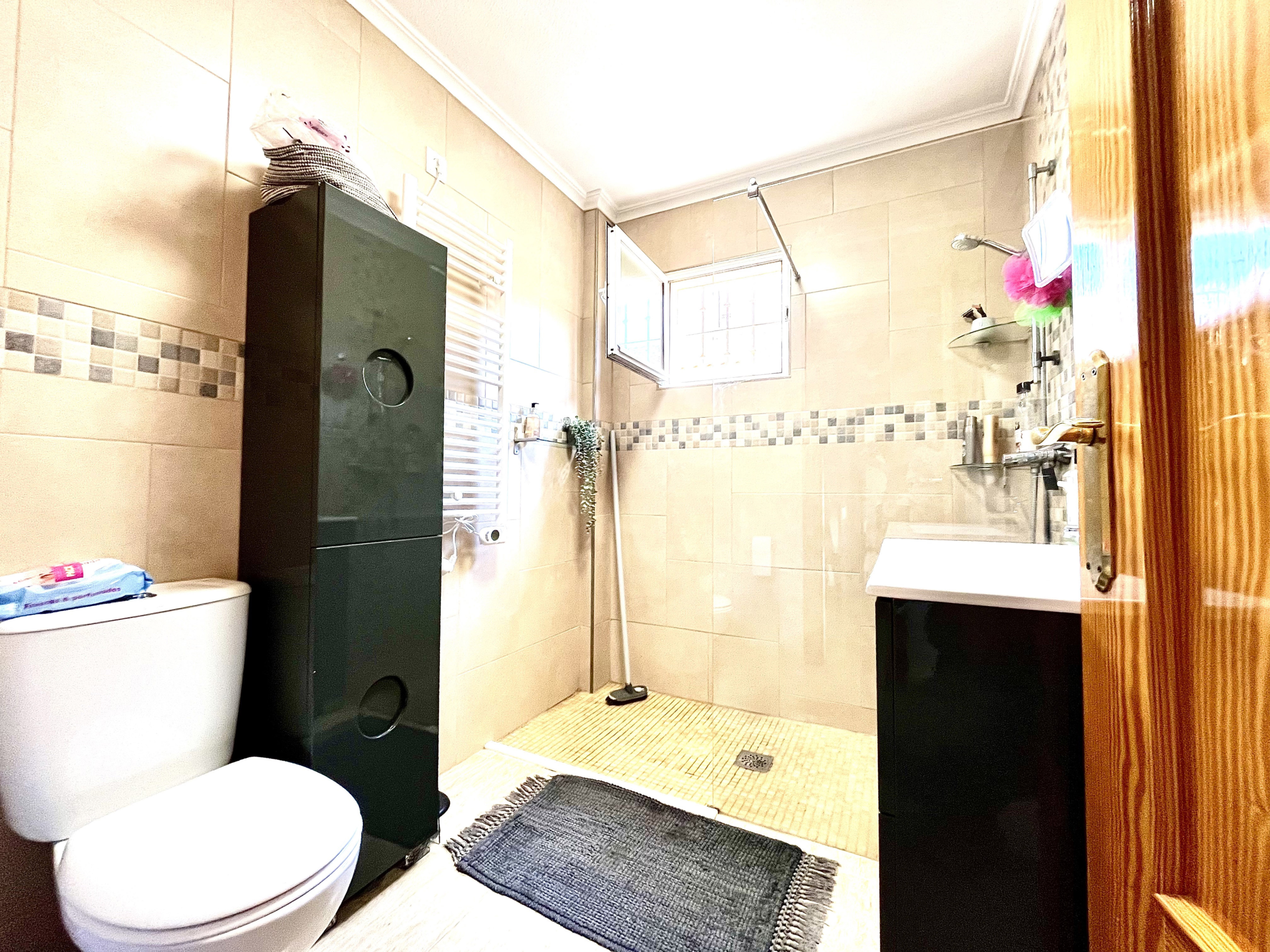 Modern family bathroom with walk-in shower in Los Narejos house by Levante Properties.