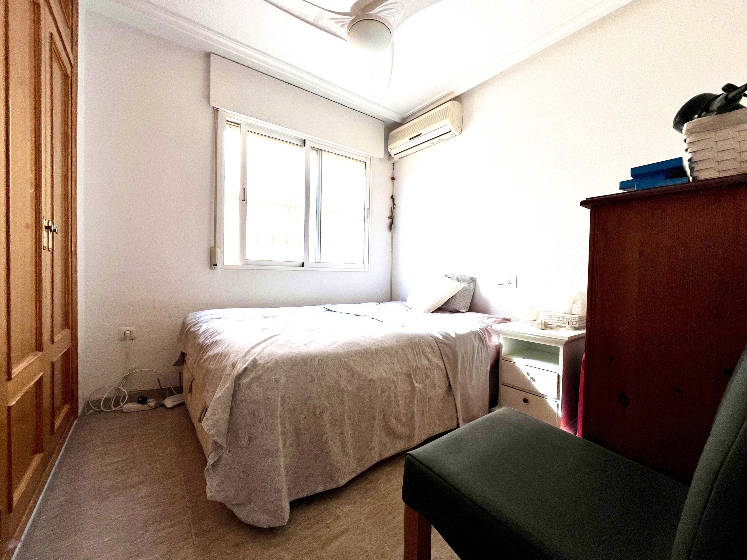 Bright double bedroom with air conditioning in Los Alcázares house by Levante Properties.