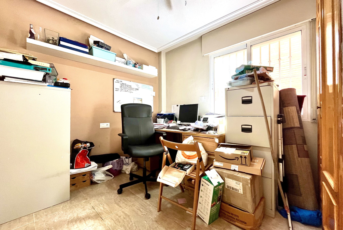 Guest bedroom currently used as office in semi-detached Los Narejos property by Levante Properties.