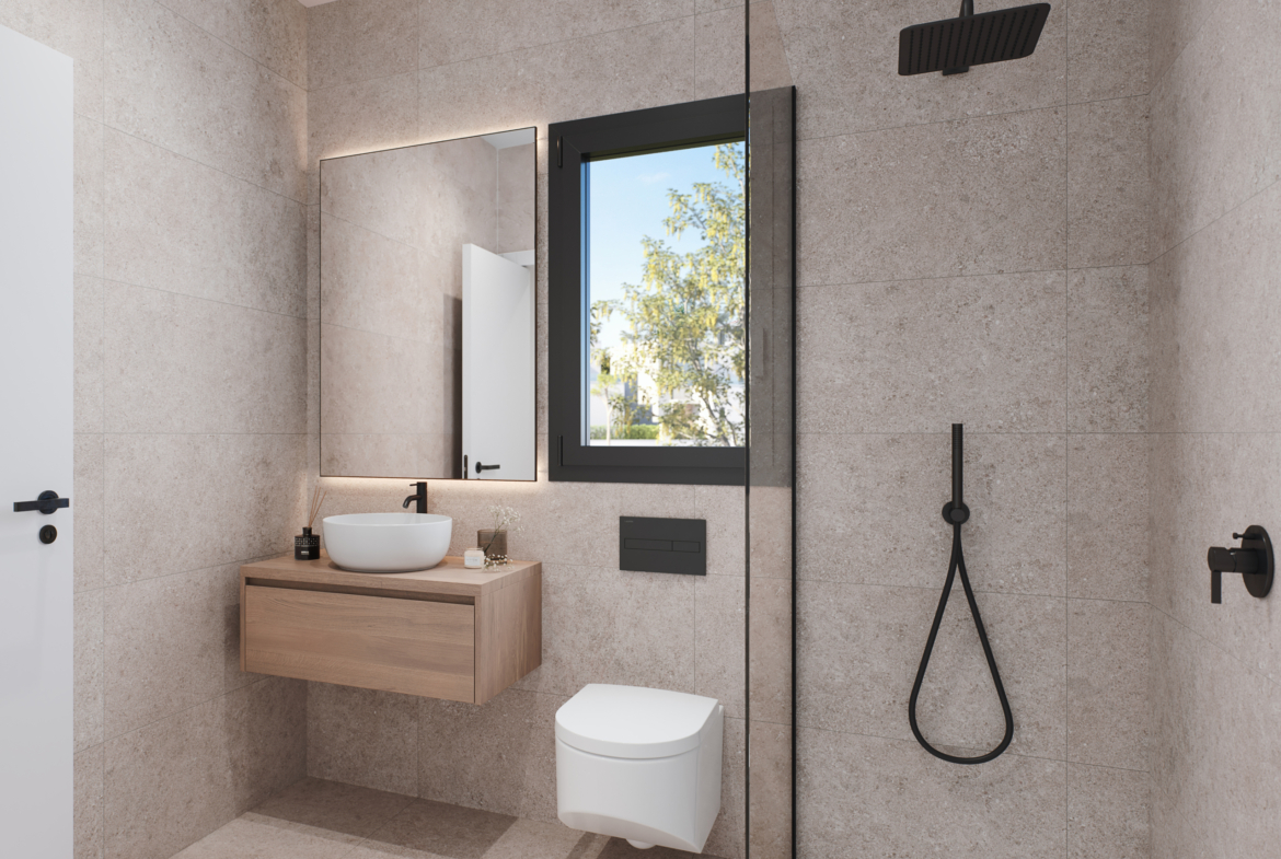 Stylish modern bathroom with contemporary fixtures and finishes at Tindra El Lago Apartments, Santa Rosalia, by Levante Properties.