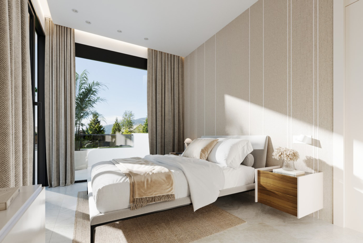 Luxury master bedroom suite in Orbesol Mirador Villa at Santa Rosalia, listed by Levante Properties and complemented by a modern designer kitchen.