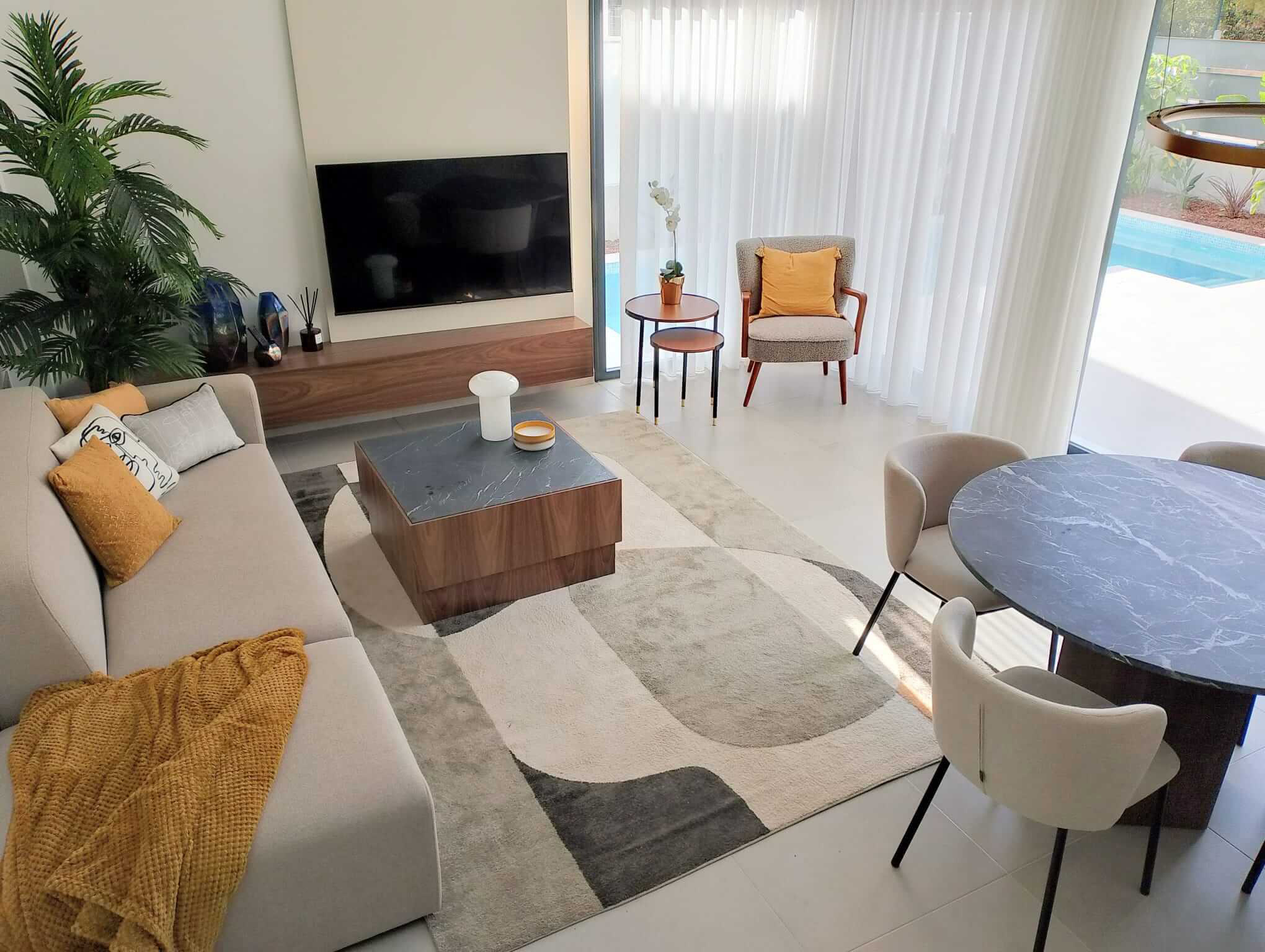 Modern open-plan living and dining area in Tindra Villas at Roda Golf by Levante Properties