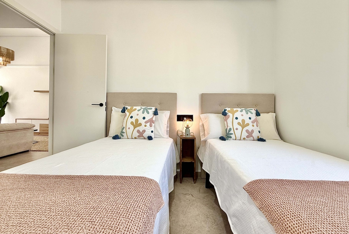 Modernised bedroom with climate control at the Rondella villa in Mar Menor Golf Resort.