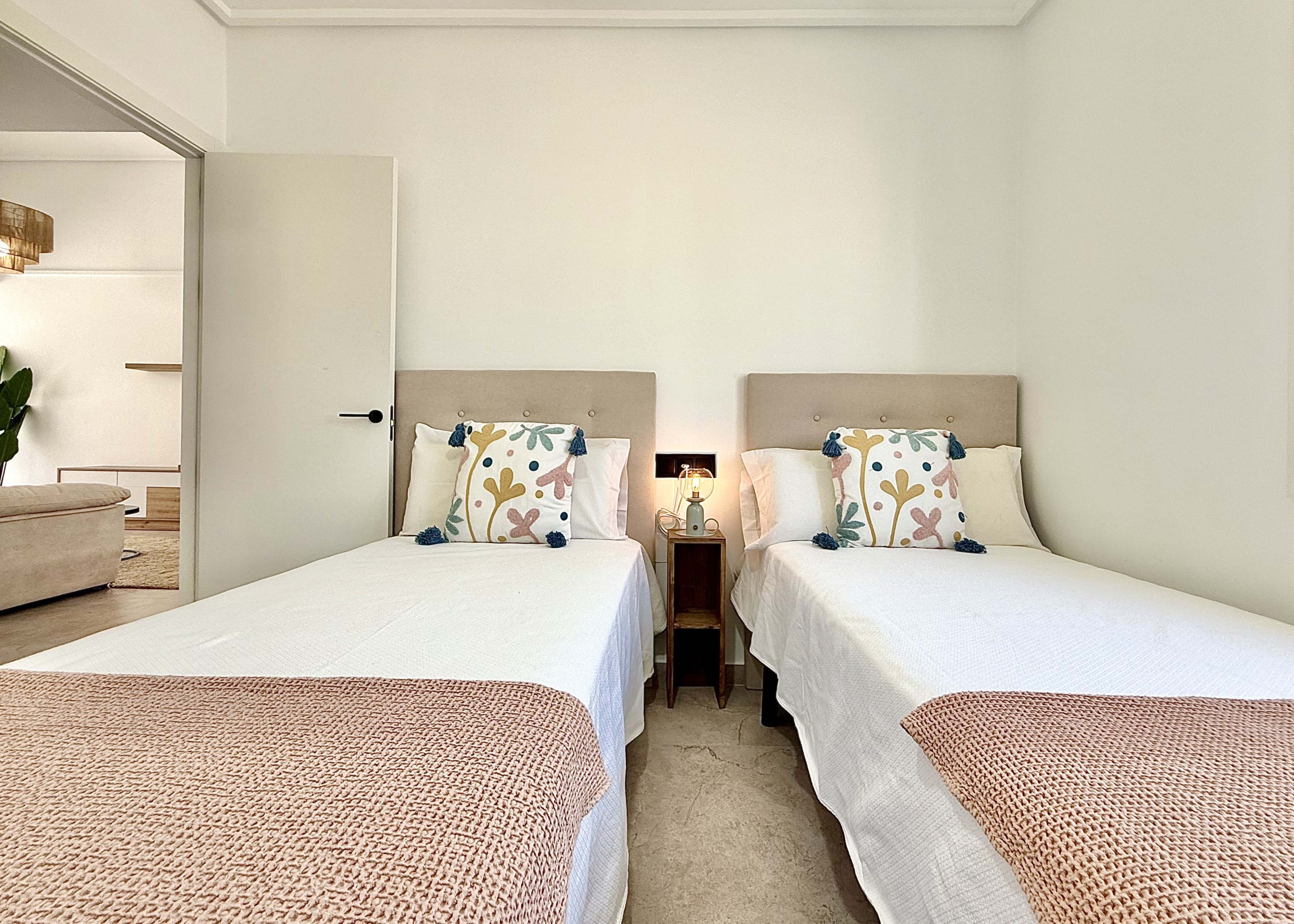 Modernised bedroom with climate control at the Rondella villa in Mar Menor Golf Resort.