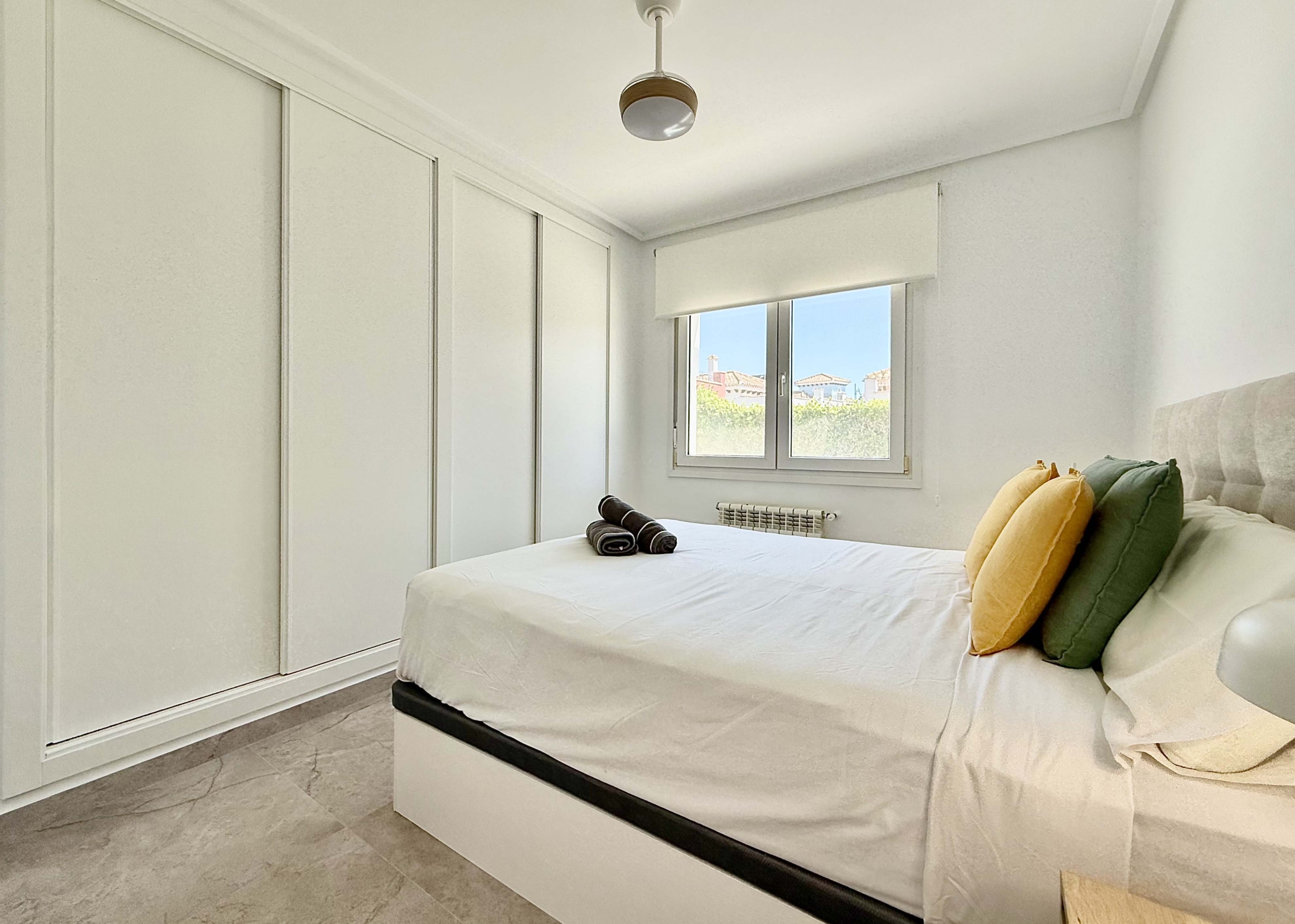 Modernised bedroom with climate control at the Rondella villa in Mar Menor Golf Resort.