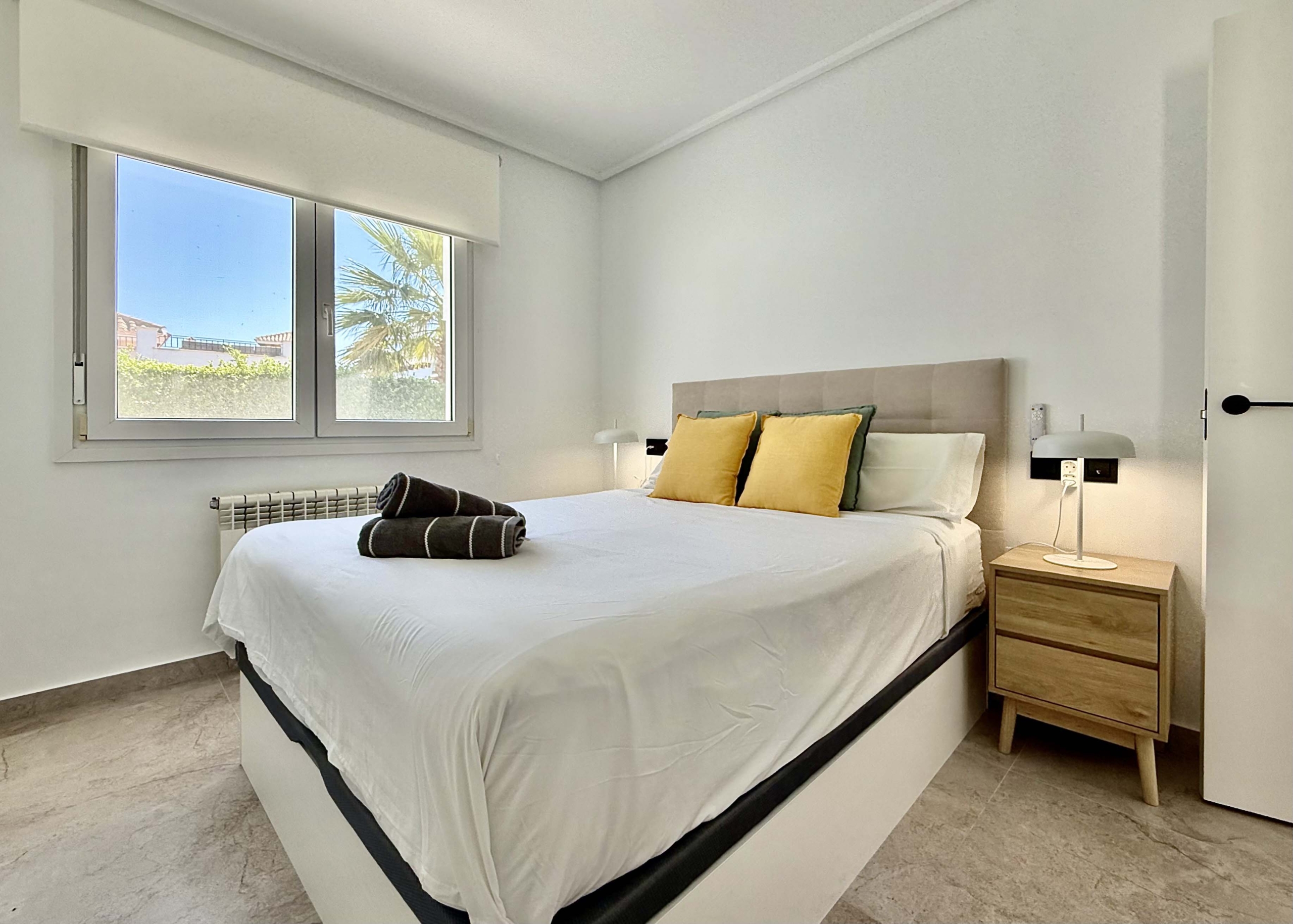 Modernised bedroom with climate control at the Rondella villa in Mar Menor Golf Resort.