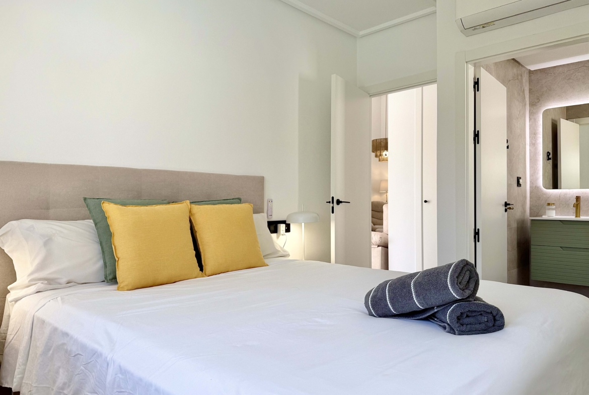 Modernised bedroom with climate control at the Rondella villa in Mar Menor Golf Resort.