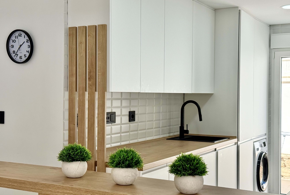 Levante Properties presents this modernised kitchen fitted with premium appliances and elegant finishes at Mar Menor Golf Resort.