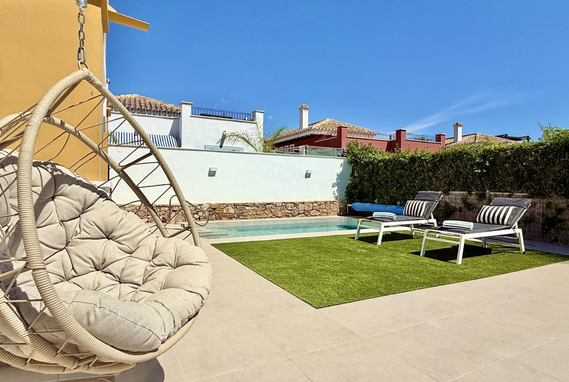 Private heated pool and landscaped garden at the Rondella villa in Mar Menor Golf Resort.