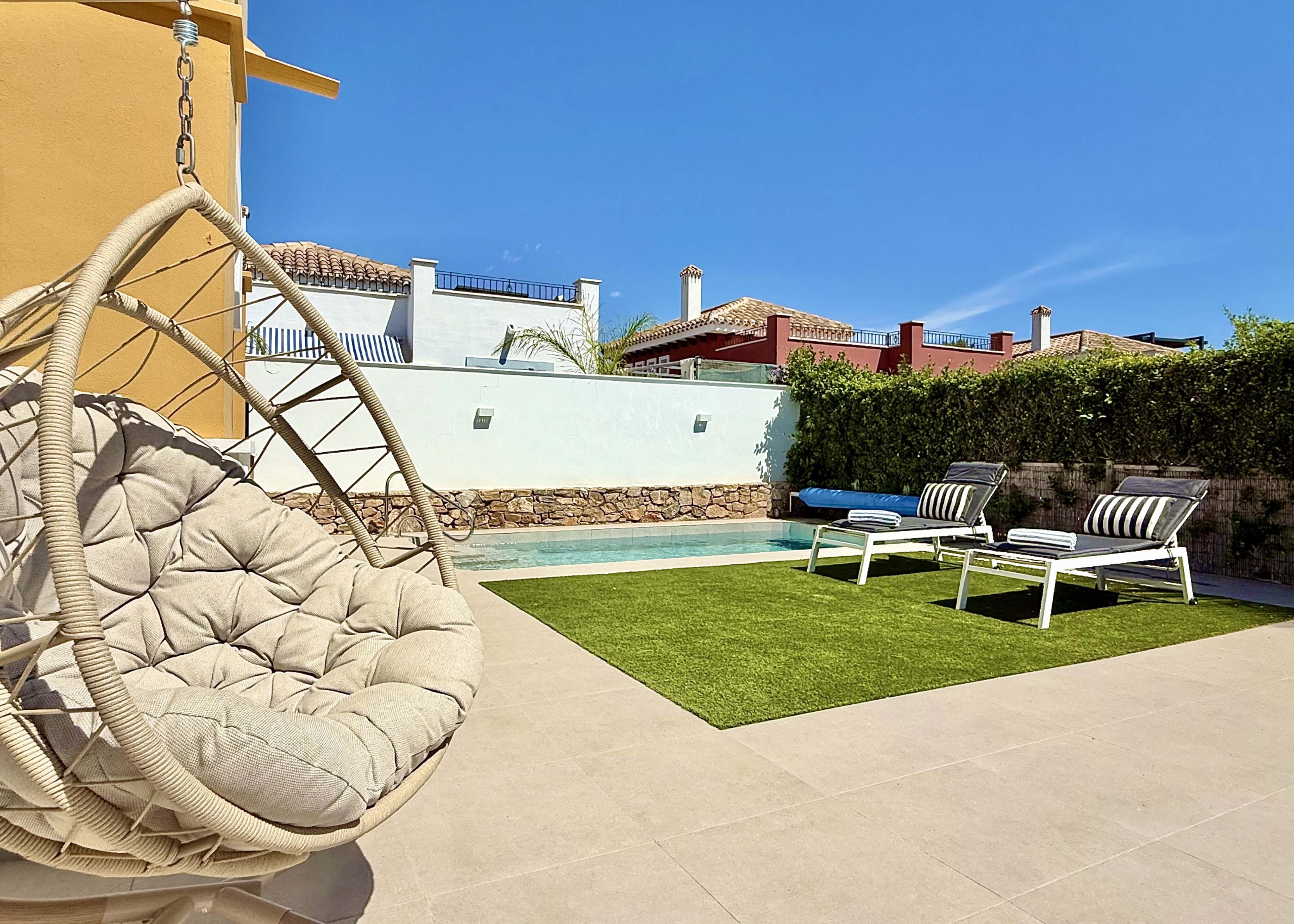Private heated pool and landscaped garden at the Rondella villa in Mar Menor Golf Resort.