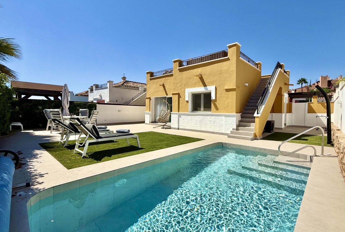 Private heated pool and landscaped garden at the Rondella villa in Mar Menor Golf Resort.