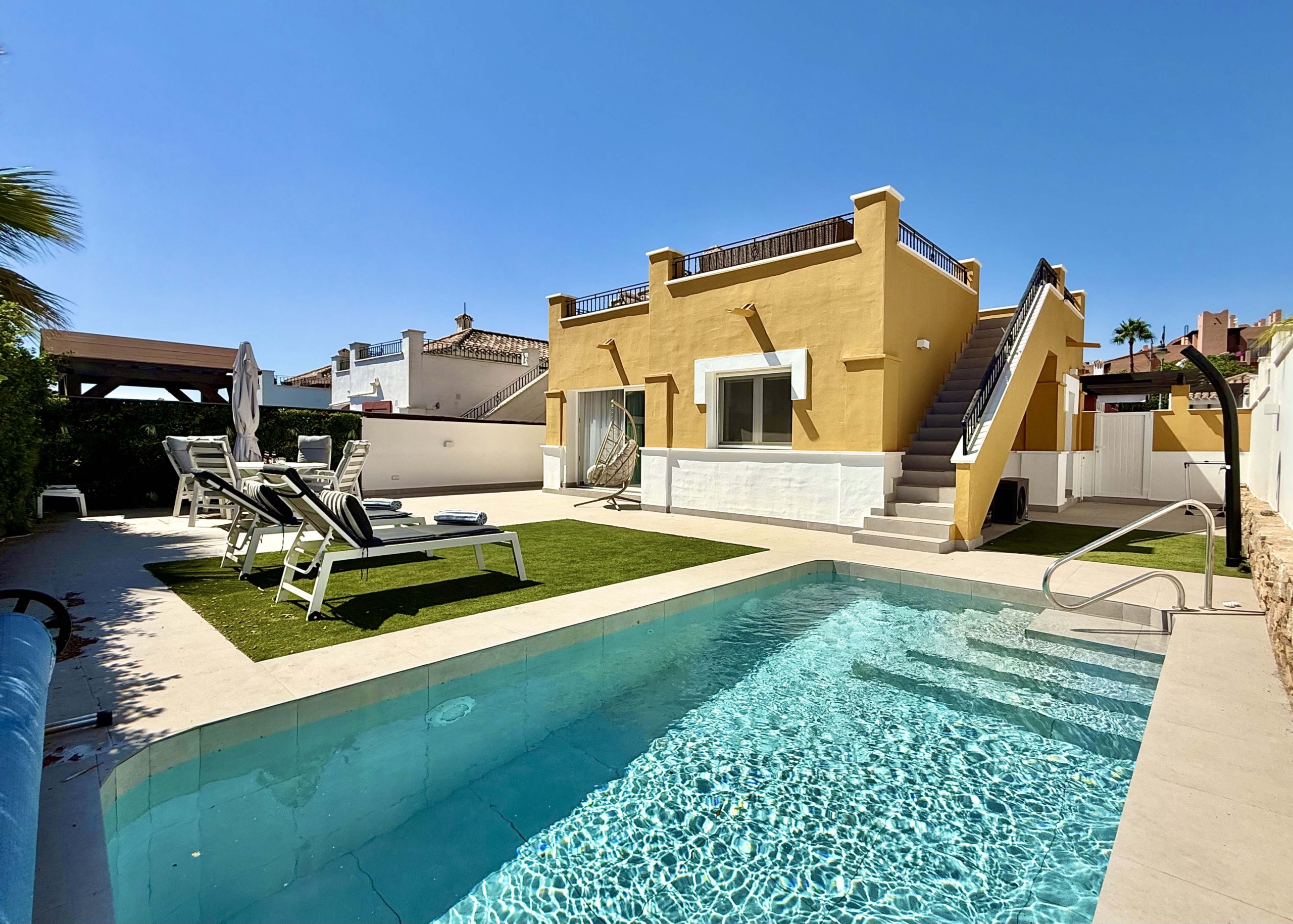 Private heated pool and landscaped garden at the Rondella villa in Mar Menor Golf Resort.