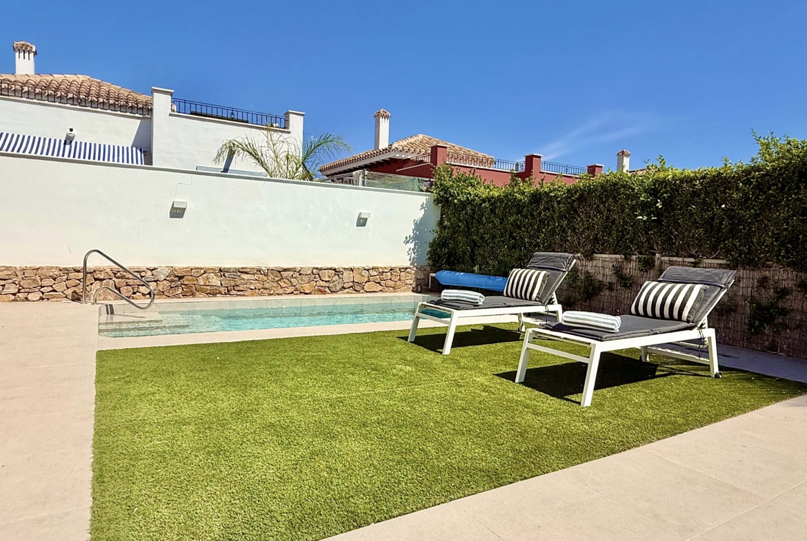Private heated pool and landscaped garden at the Rondella villa in Mar Menor Golf Resort.