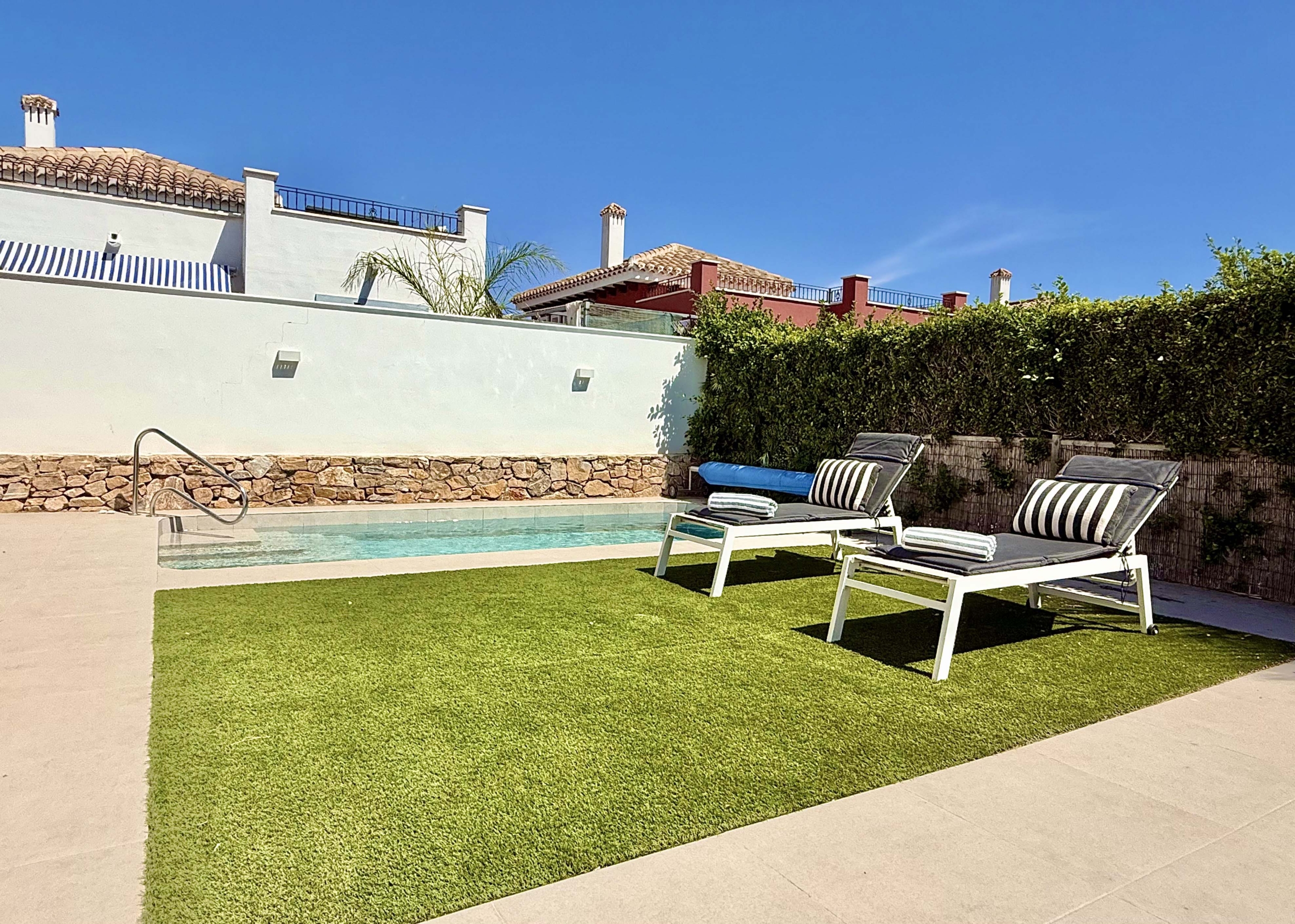 Private heated pool and landscaped garden at the Rondella villa in Mar Menor Golf Resort.