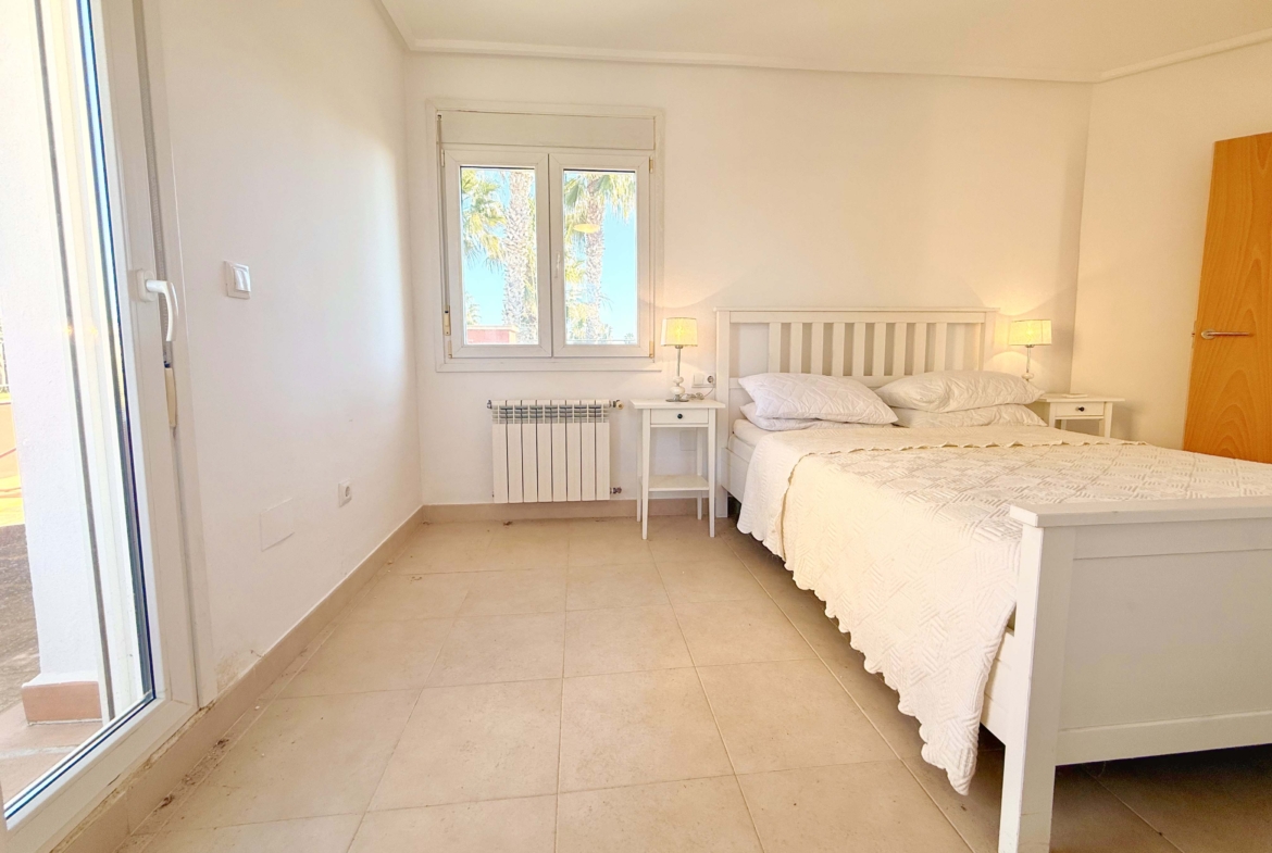 Master bedroom with private terrace and golf views at Mar Menor Golf Resort villa by Levante Properties