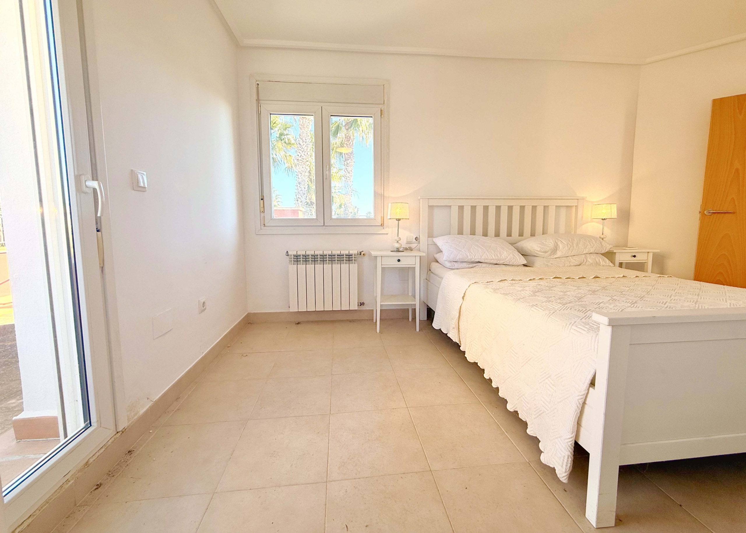 Master bedroom with private terrace and golf views at Mar Menor Golf Resort villa by Levante Properties