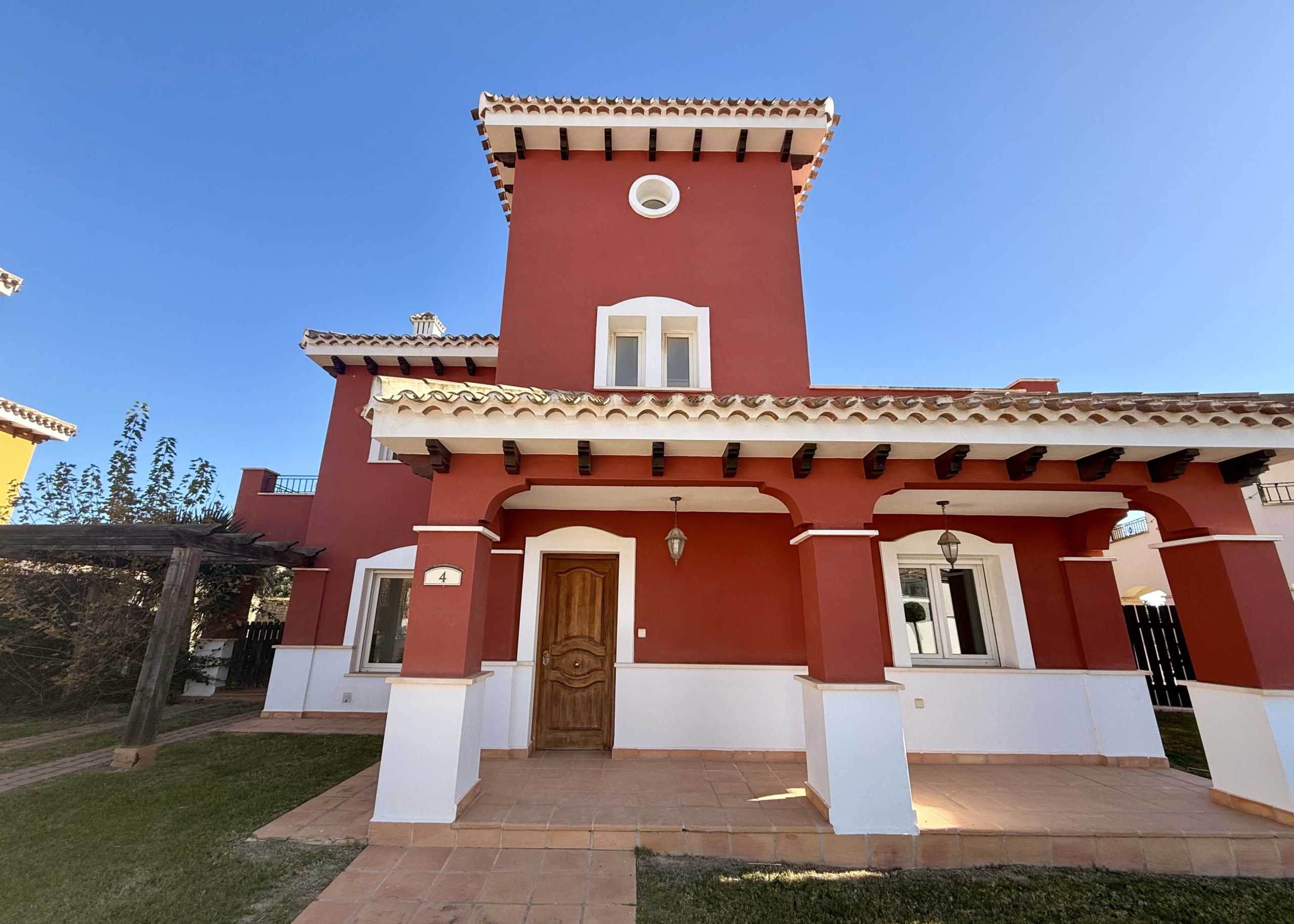 Front exterior of a 4-bedroom villa with private pool on Mar Menor Golf Resort by Levante Properties