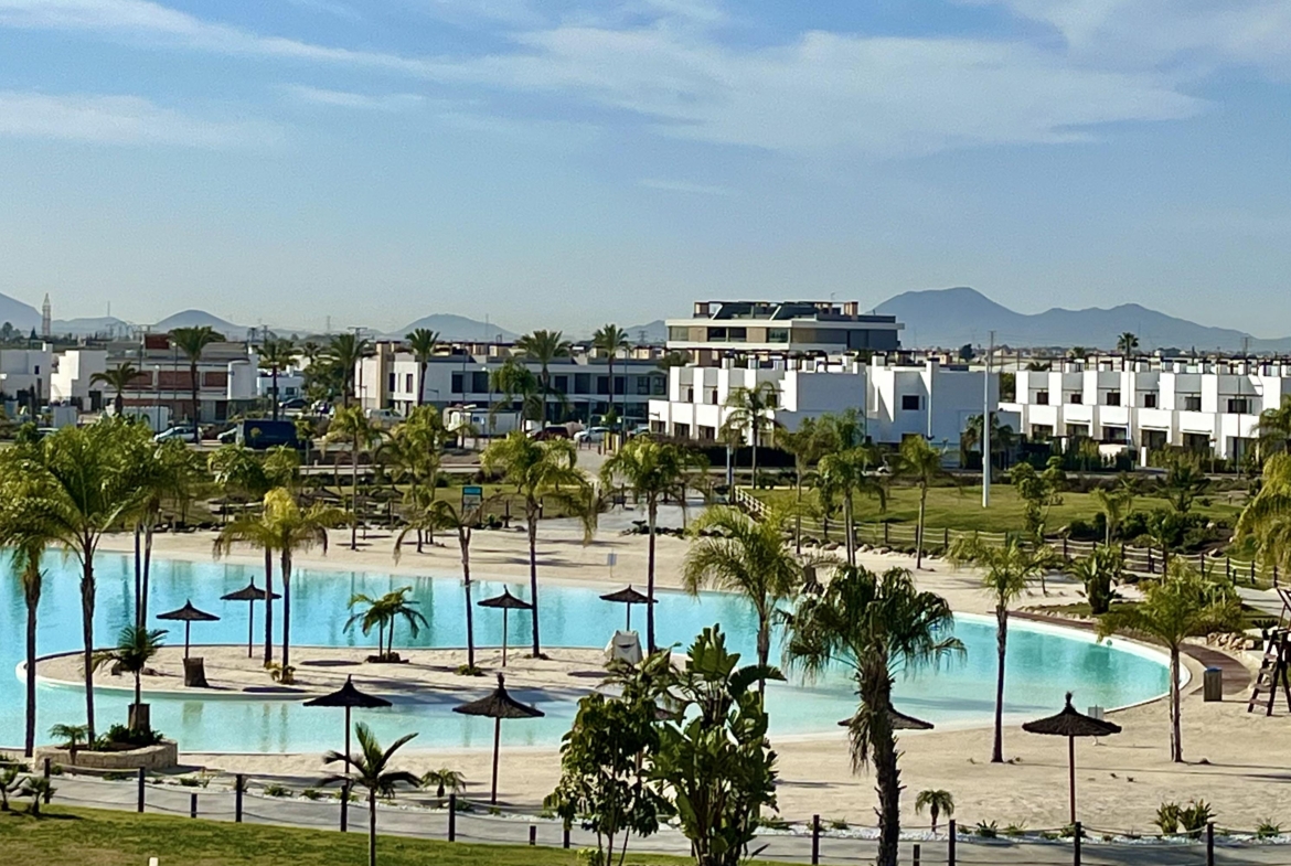 Crystal-clear lake and white sandy beaches at Santa Rosalía Lake & Life Resort by Levante Properties Caption: