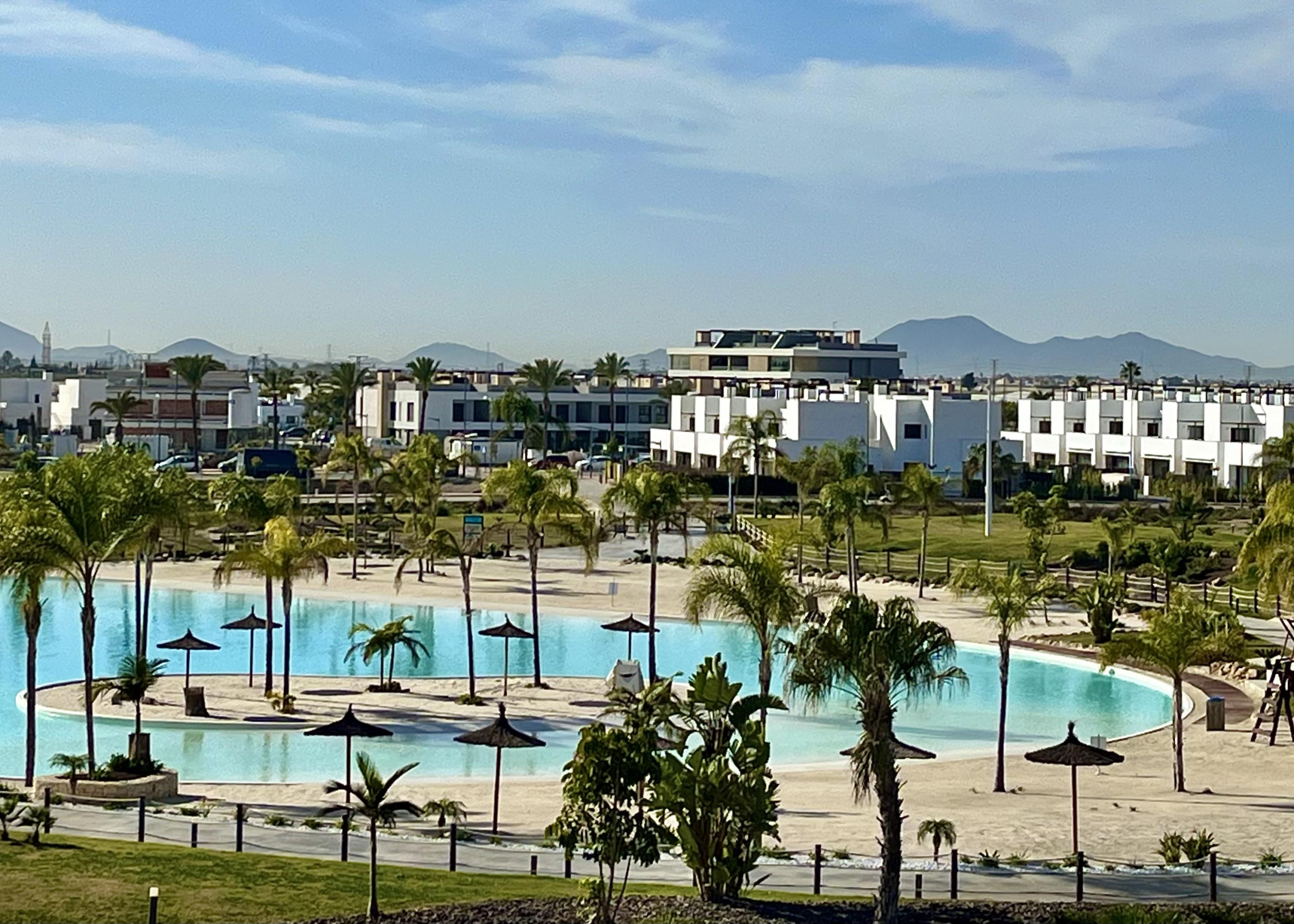 Crystal-clear lake and white sandy beaches at Santa Rosalía Lake & Life Resort by Levante Properties Caption: