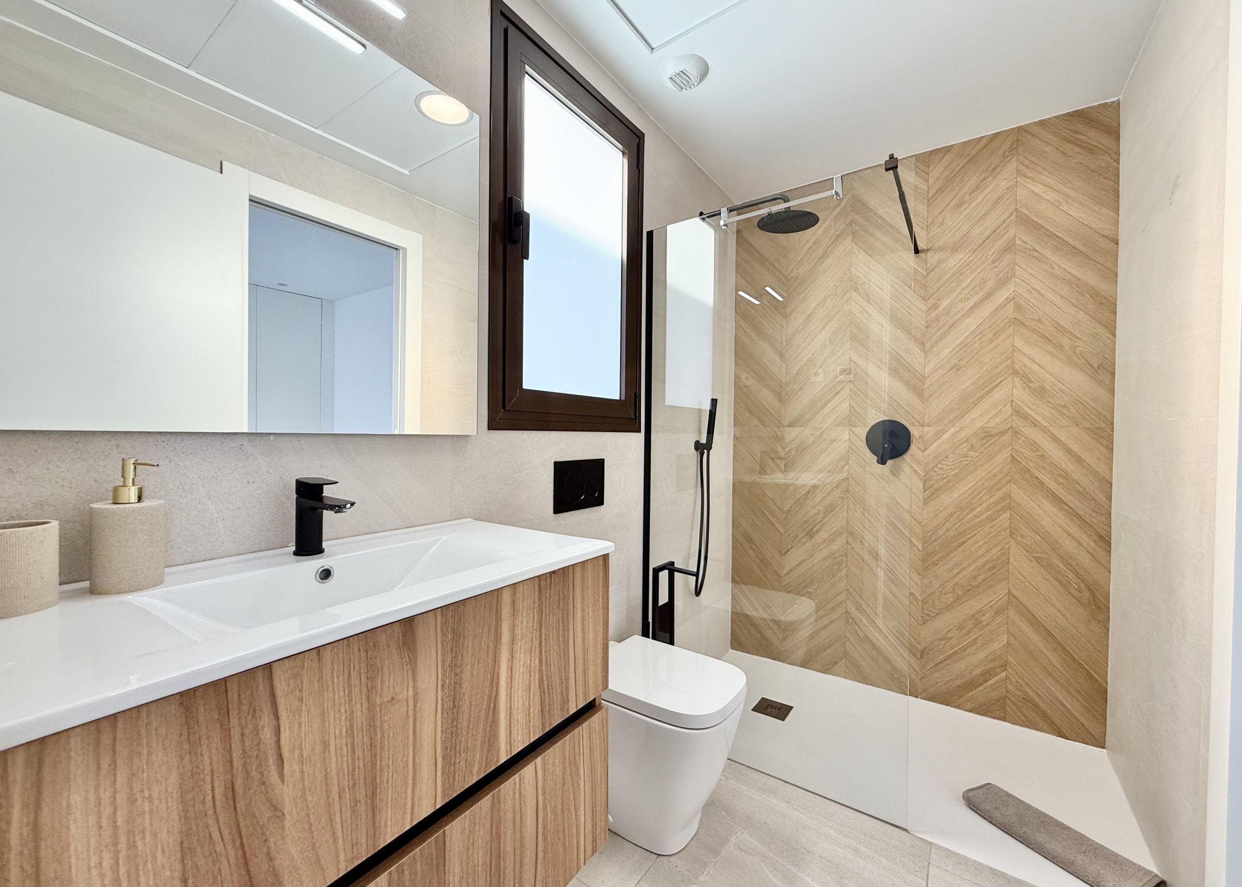 Stylish bathroom with walk-in shower presented by Levante Properties