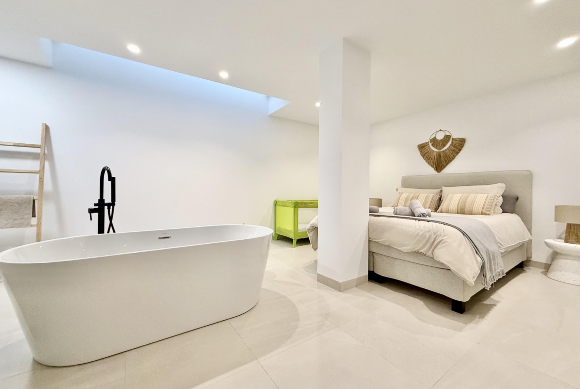 Luxury basement suite with kitchen and freestanding bath in Lavanda villa Santa Rosalia by Levante Properties