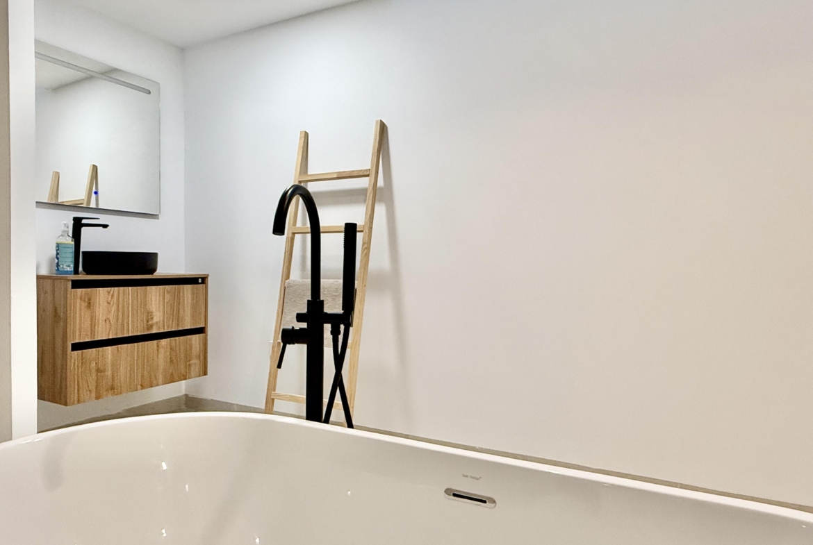 Luxury basement suite with kitchen and freestanding bath in Lavanda villa Santa Rosalia by Levante Properties