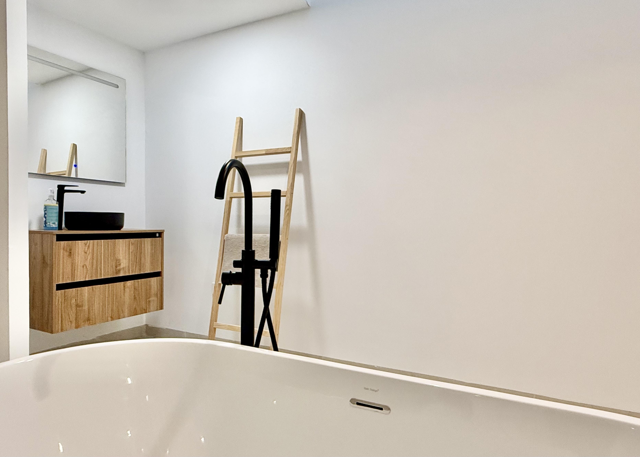 Luxury basement suite with kitchen and freestanding bath in Lavanda villa Santa Rosalia by Levante Properties