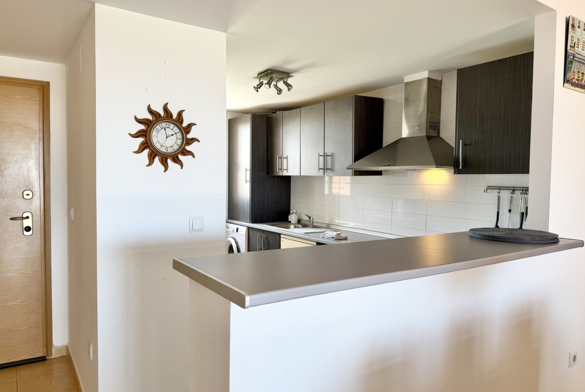Modern open-plan kitchen in luxury penthouse Mar Menor Golf Resort Levante Properties