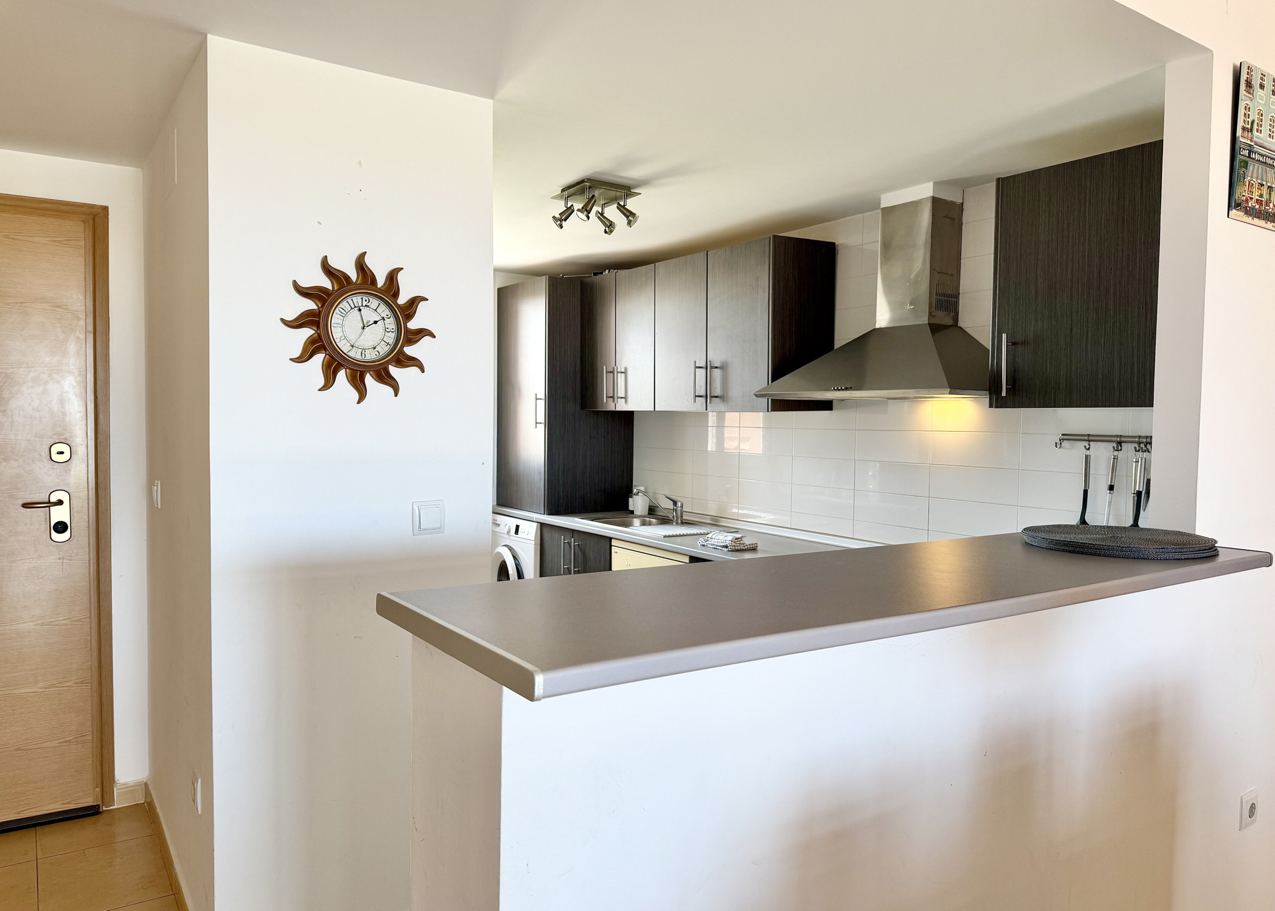 Modern open-plan kitchen in luxury penthouse Mar Menor Golf Resort Levante Properties