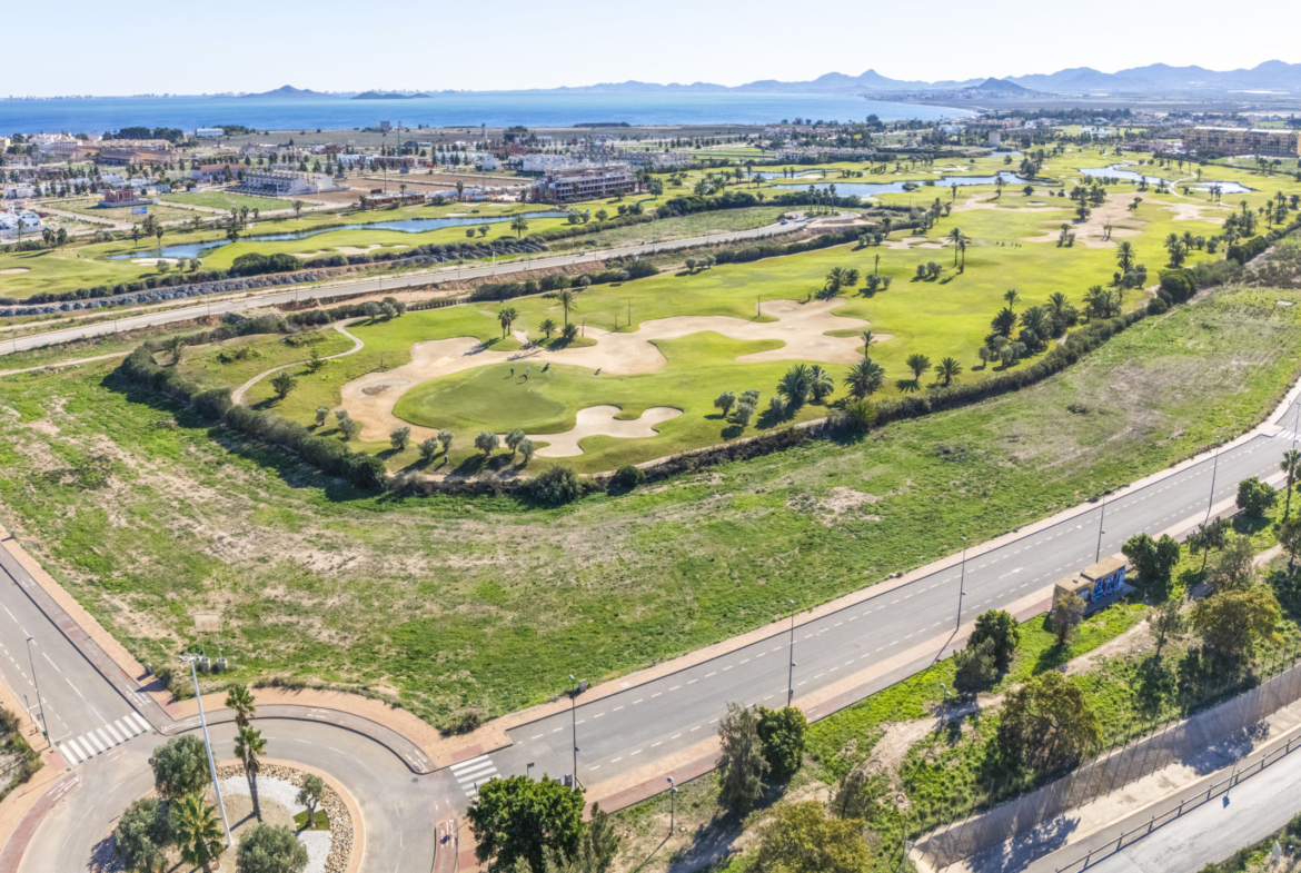 Aerial view of Apartments La Serena Golf with golf-course views by Levante Properties