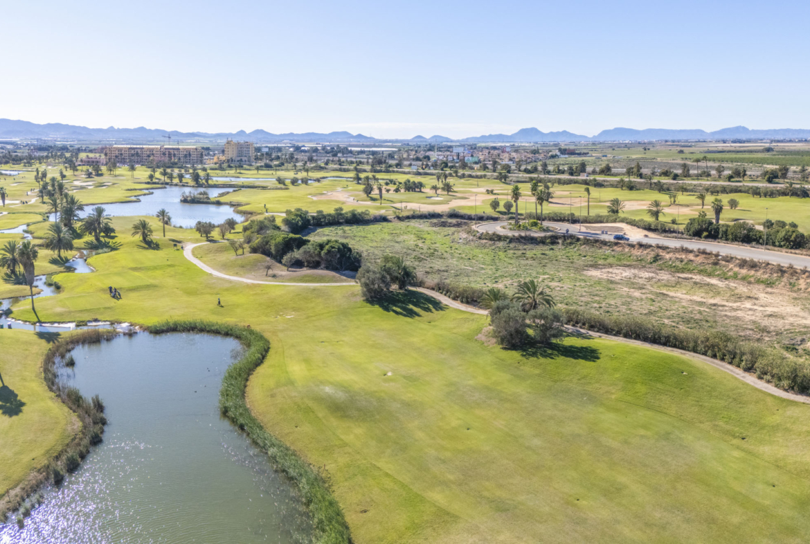 Aerial view of Apartments La Serena Golf with golf-course views by Levante Properties