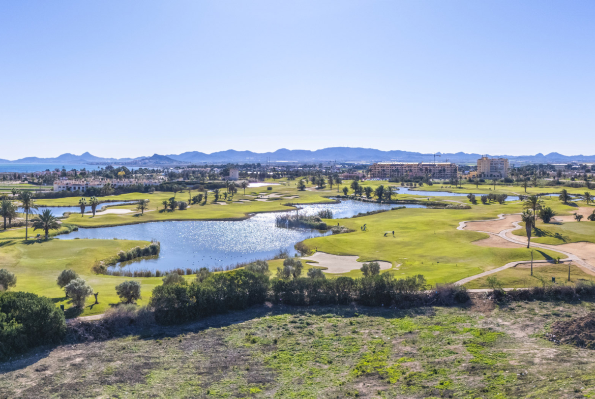 Aerial view of Apartments La Serena Golf with golf-course views by Levante Properties