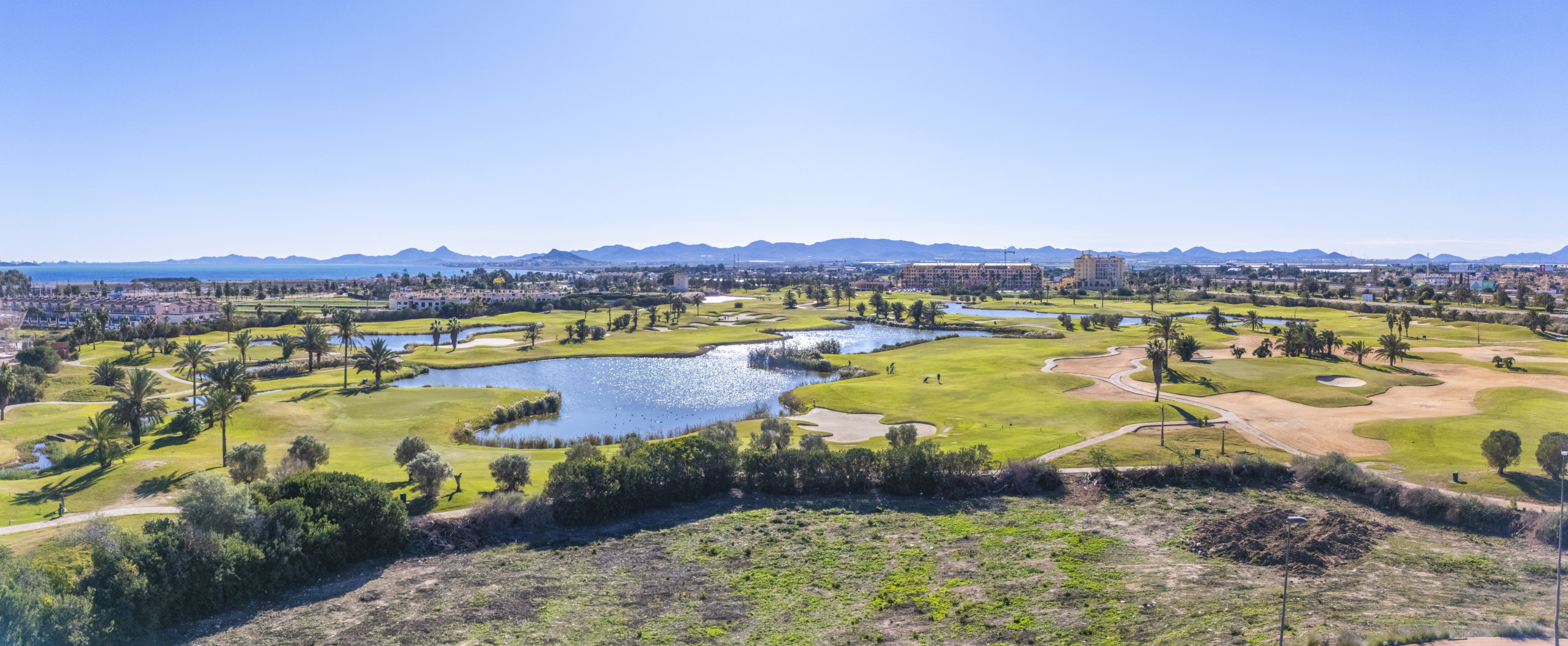 Aerial view of Apartments La Serena Golf with golf-course views by Levante Properties