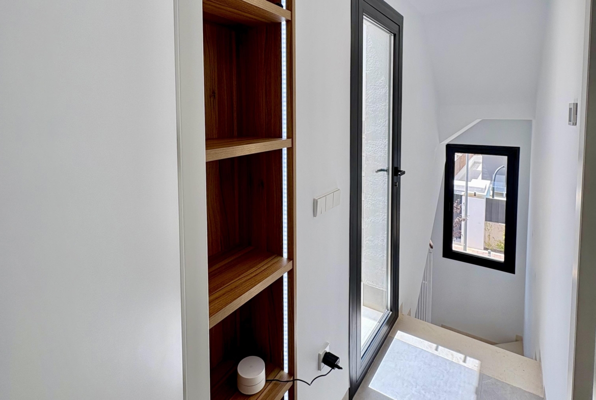 Modern staircase in Villa Almendro at Santa Rosalía Lake & Life Resort by Levante Properties