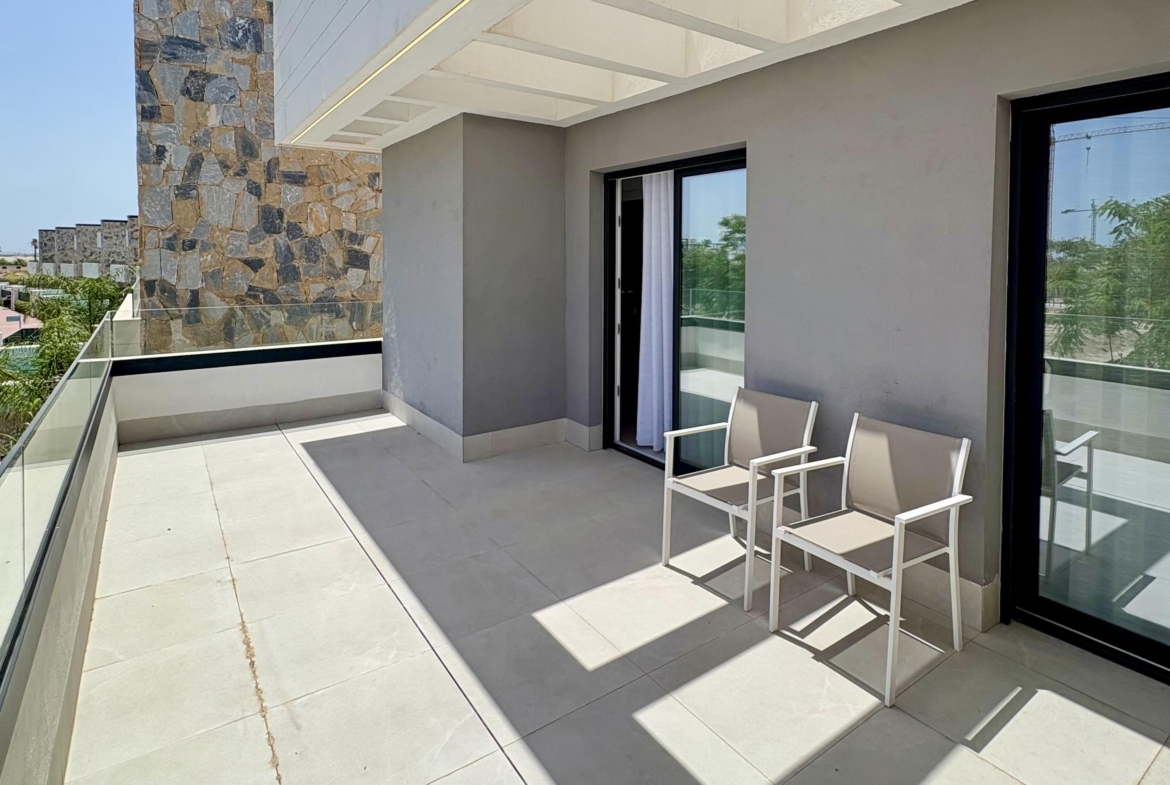 Master bedroom with balcony overlooking the pool and lake at Santa Rosalía