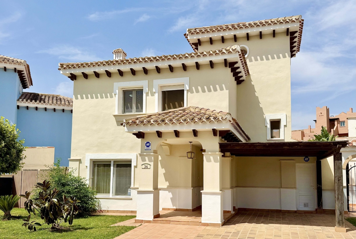Front exterior of a Baron villa with fountain views at Mar Menor Golf Resort, presented by Levante Properties.