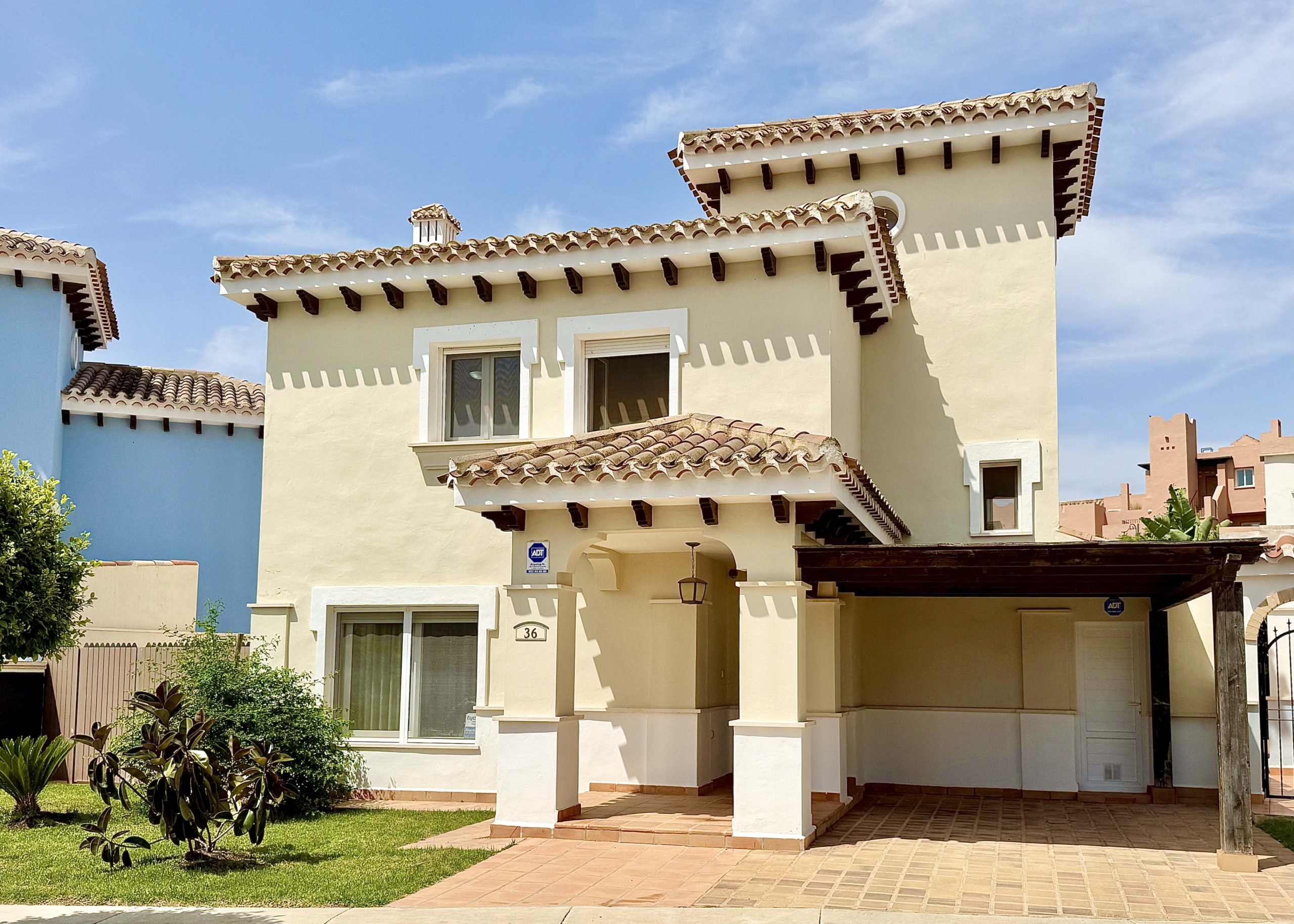 Front exterior of a Baron villa with fountain views at Mar Menor Golf Resort, presented by Levante Properties.
