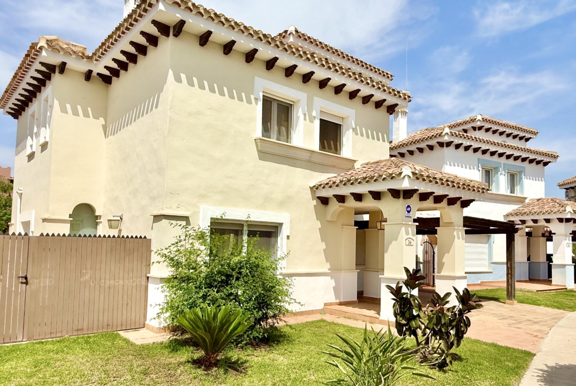 Front exterior of a Baron villa with fountain views at Mar Menor Golf Resort, presented by Levante Properties.