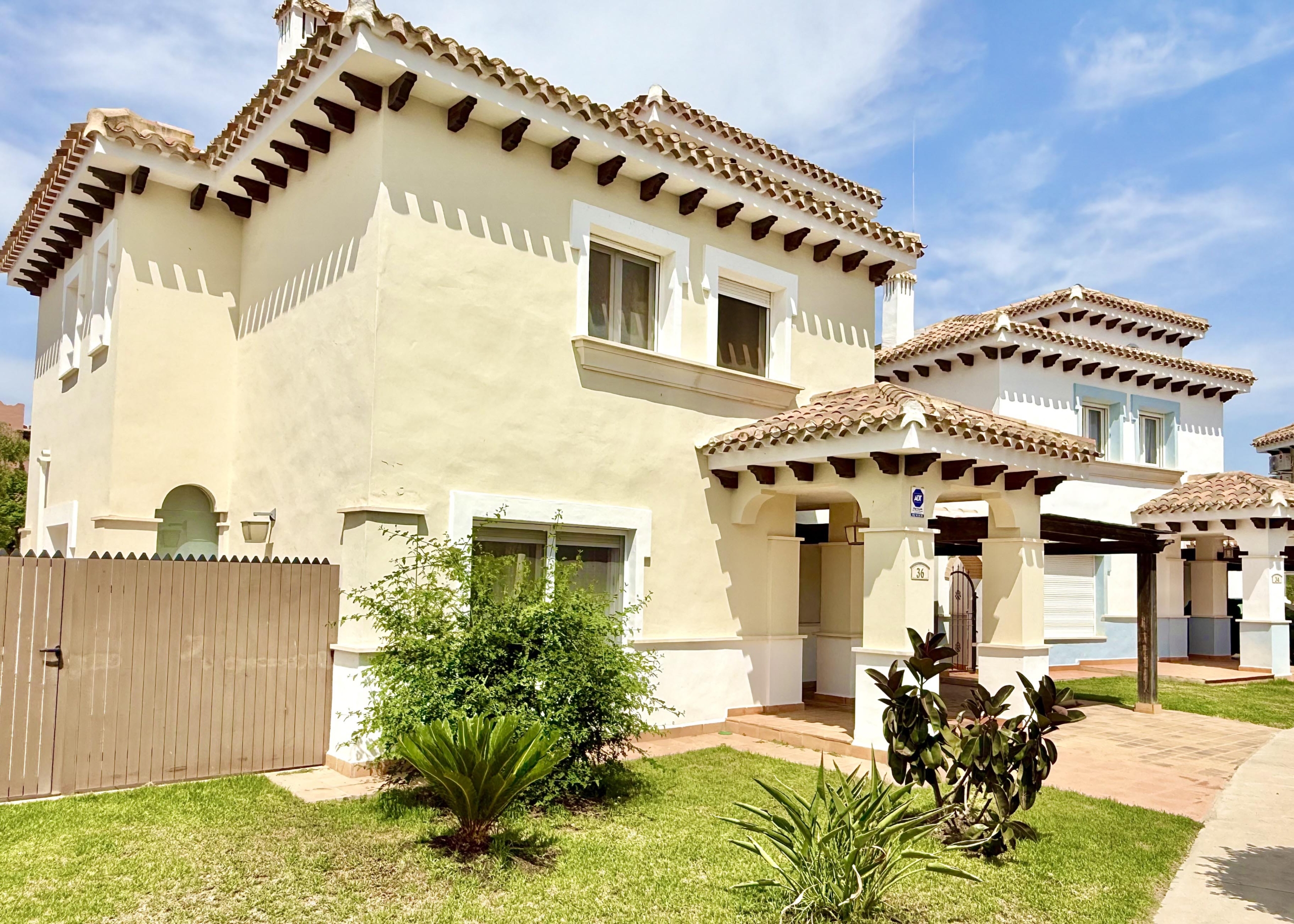 Front exterior of a Baron villa with fountain views at Mar Menor Golf Resort, presented by Levante Properties.