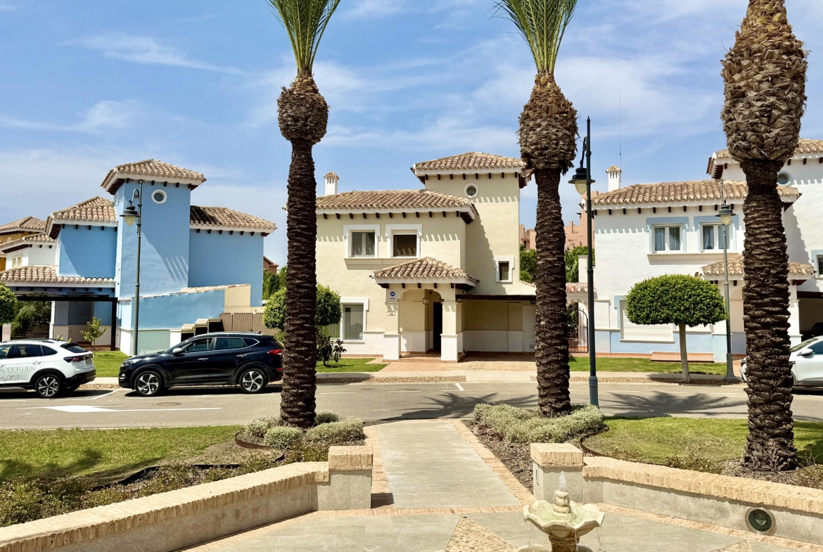 Front exterior of a Baron villa with fountain views at Mar Menor Golf Resort, presented by Levante Properties.