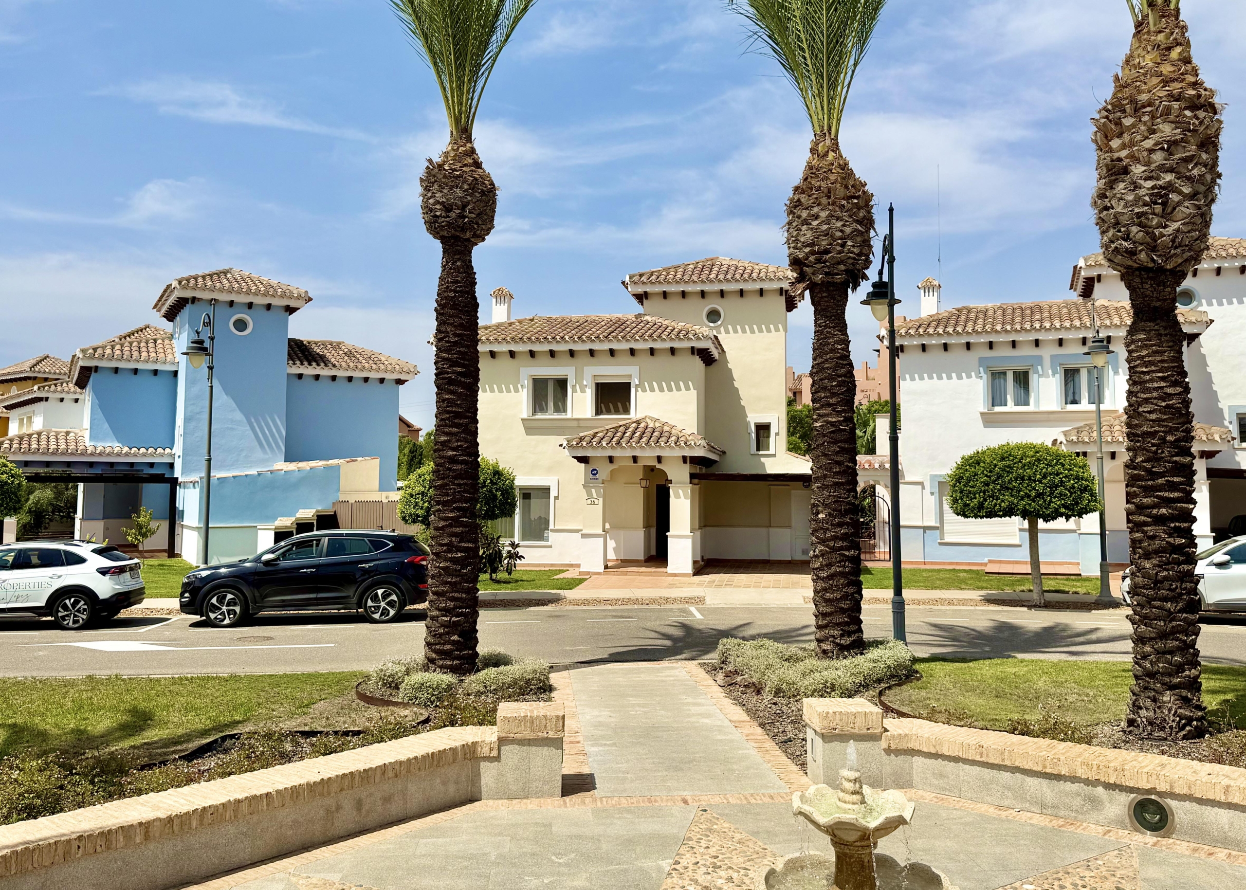 Front exterior of a Baron villa with fountain views at Mar Menor Golf Resort, presented by Levante Properties.