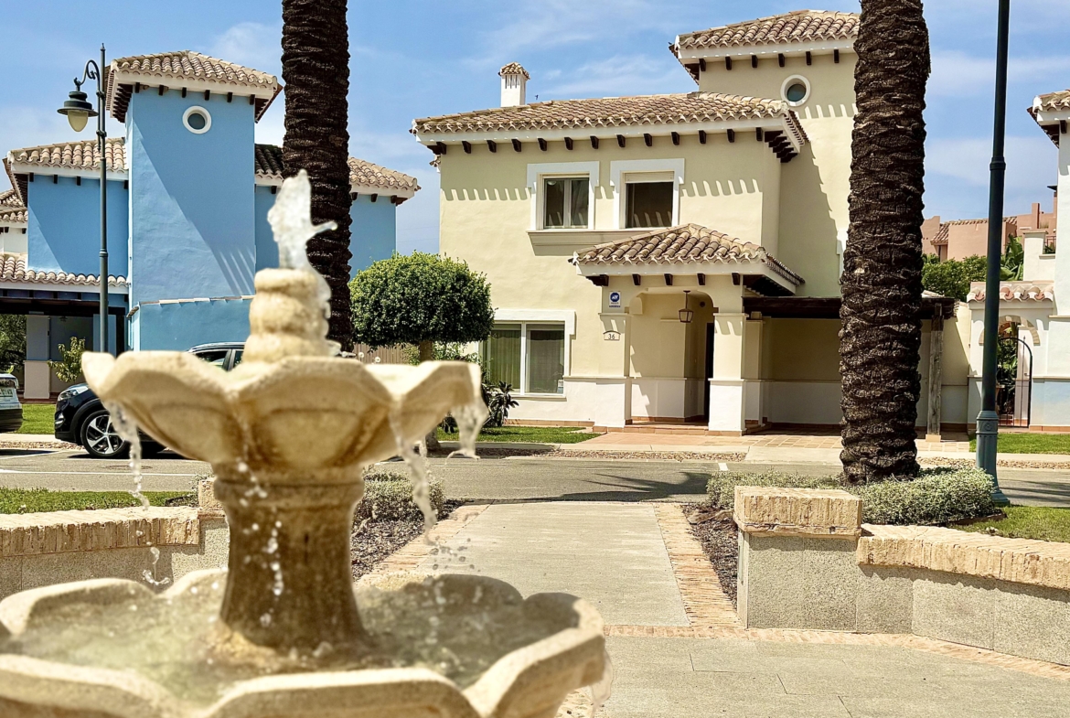 Front exterior of a Baron villa with fountain views at Mar Menor Golf Resort, presented by Levante Properties.