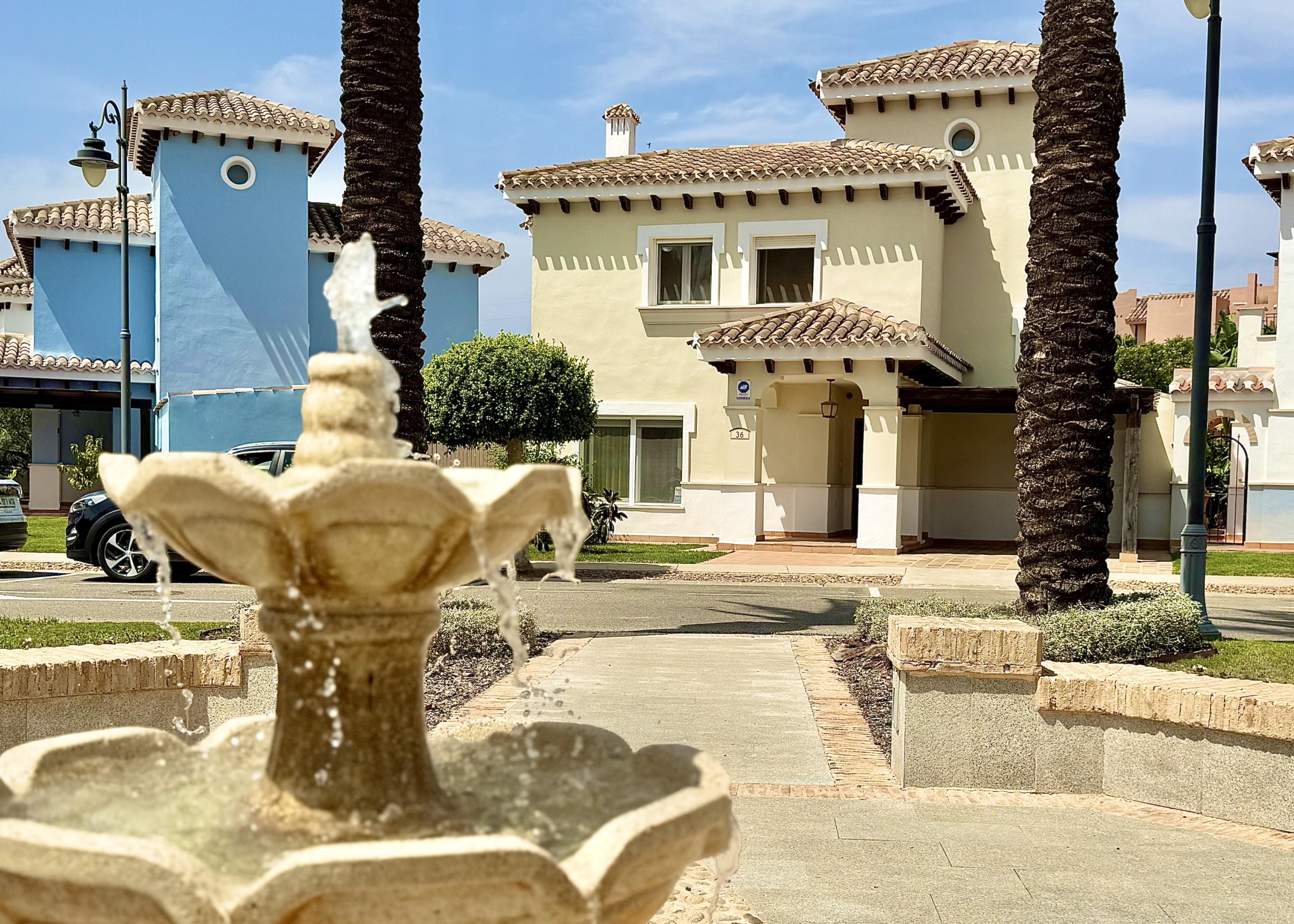 Front exterior of a Baron villa with fountain views at Mar Menor Golf Resort, presented by Levante Properties.