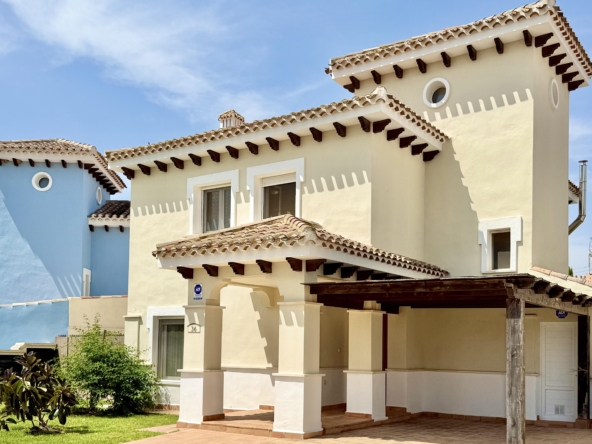 Front exterior of a four-bedroom Baron villa with fountain views in Mar Menor Golf Resort.