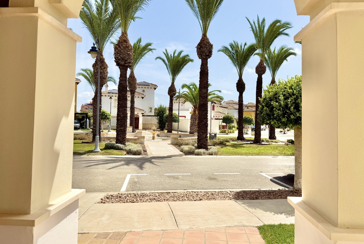 Front exterior of a Baron villa with fountain views at Mar Menor Golf Resort, presented by Levante Properties.