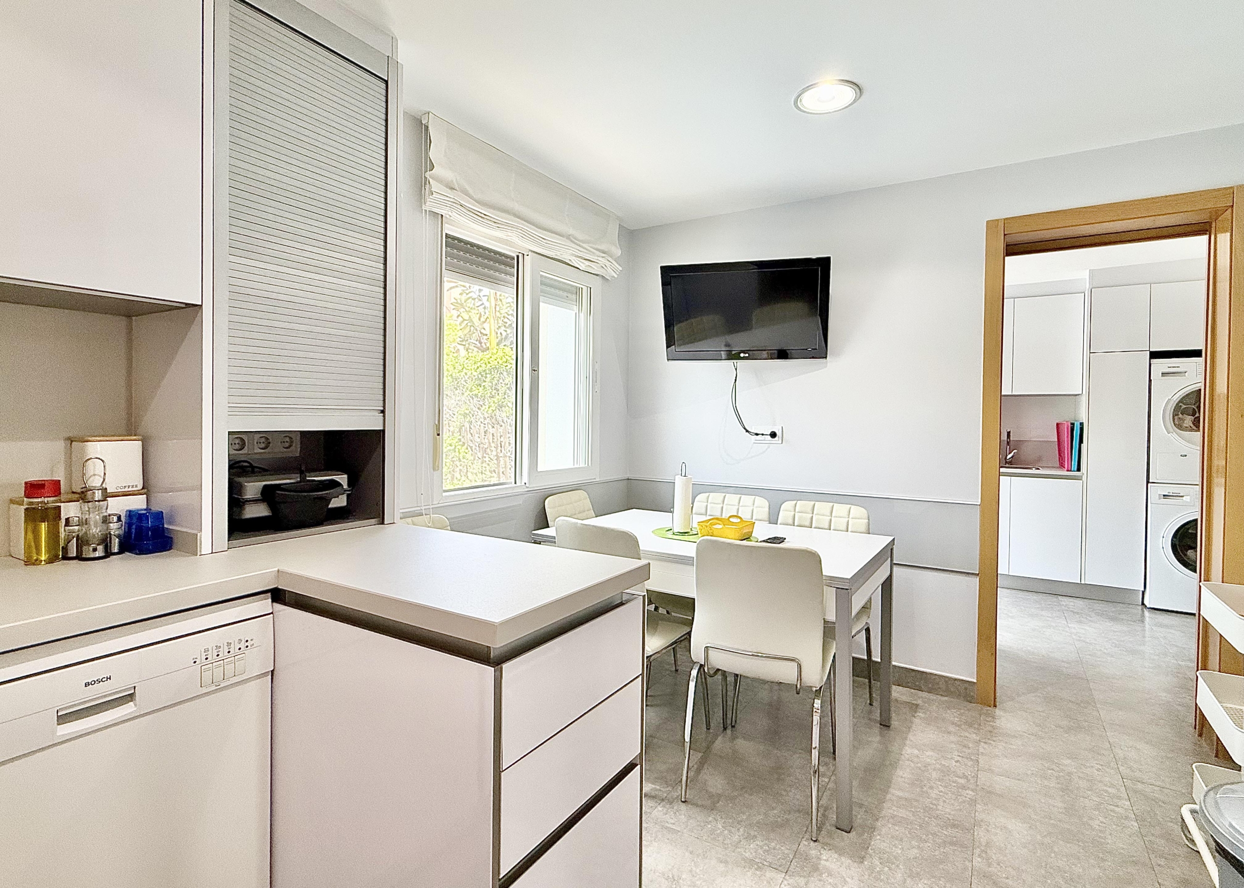 Modern extended kitchen with laundry area in a Levante Properties villa at Mar Menor Golf Resort.