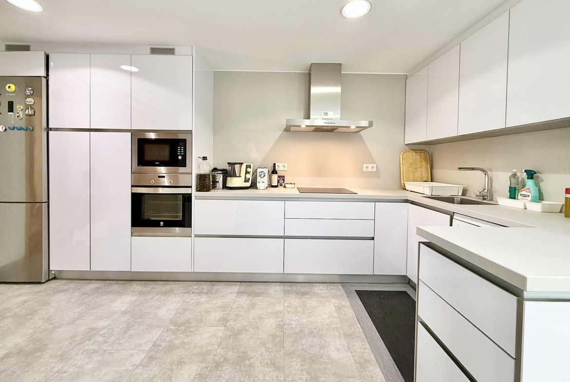 Modern extended kitchen with laundry area in a Levante Properties villa at Mar Menor Golf Resort.