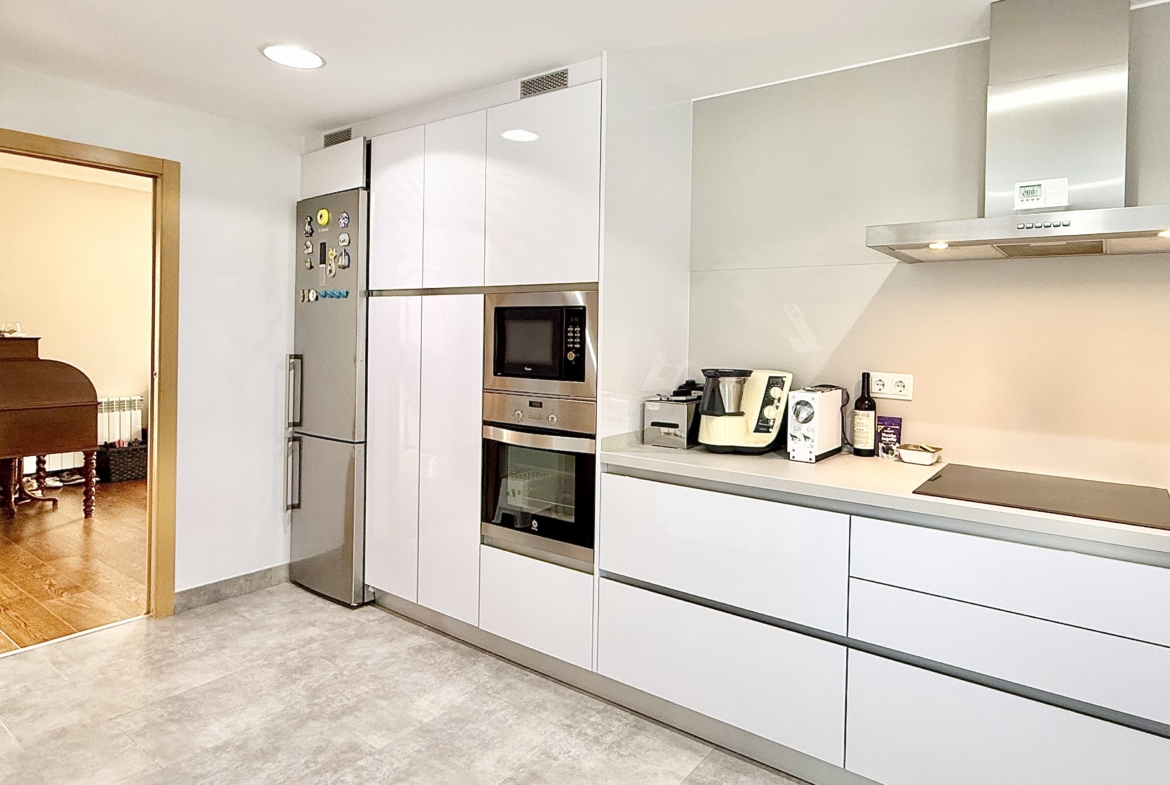 Modern extended kitchen with laundry area in a Levante Properties villa at Mar Menor Golf Resort.