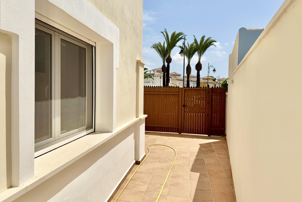 Front exterior of a Baron villa with fountain views at Mar Menor Golf Resort, presented by Levante Properties.