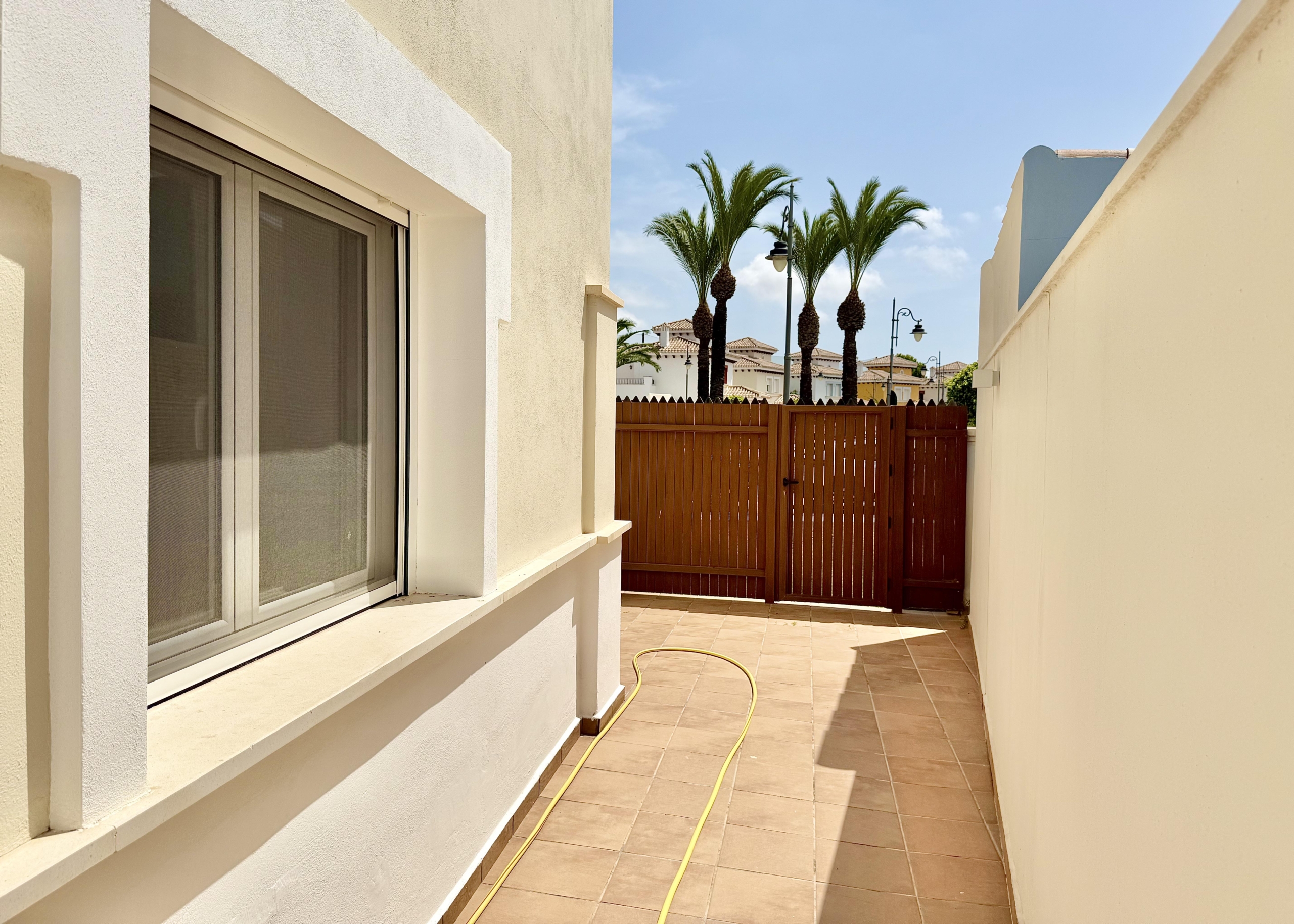 Front exterior of a Baron villa with fountain views at Mar Menor Golf Resort, presented by Levante Properties.